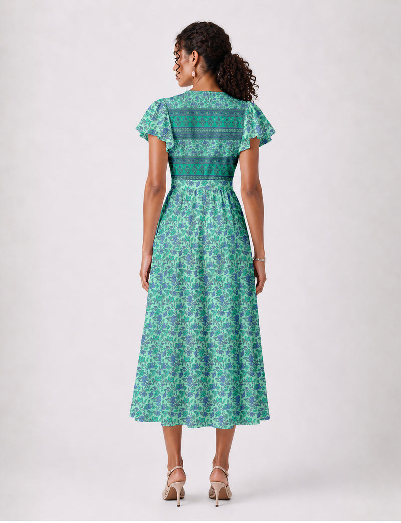 Elegant midi wrap dress with a V-neckline, adjustable waist tie, fitted bodice, and flared skirt for a timeless, flattering silhouette.