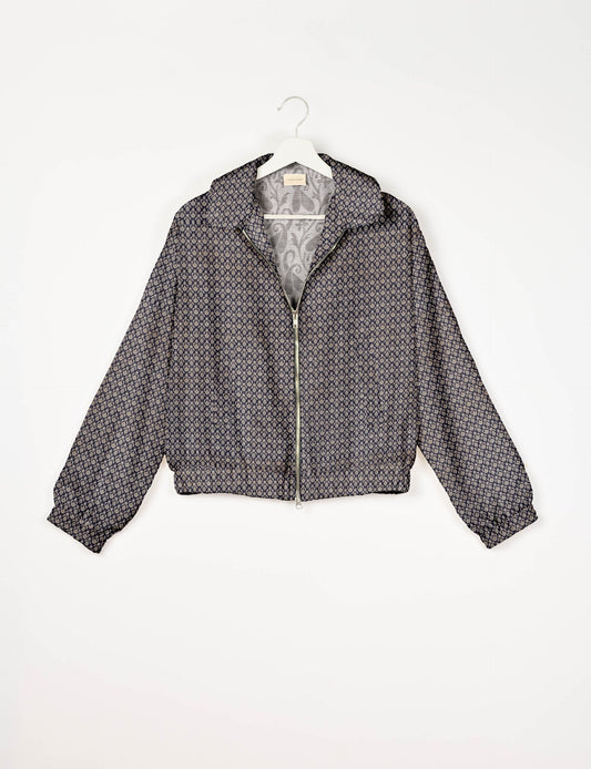 Stylish BOMBER JACKET, an upcycled clothing masterpiece with a cute cropped shape, elasticated details, and detachable metallic zipper. Contrast sari print lining adds a unique touch. Explore sustainable and eco-friendly fashion.