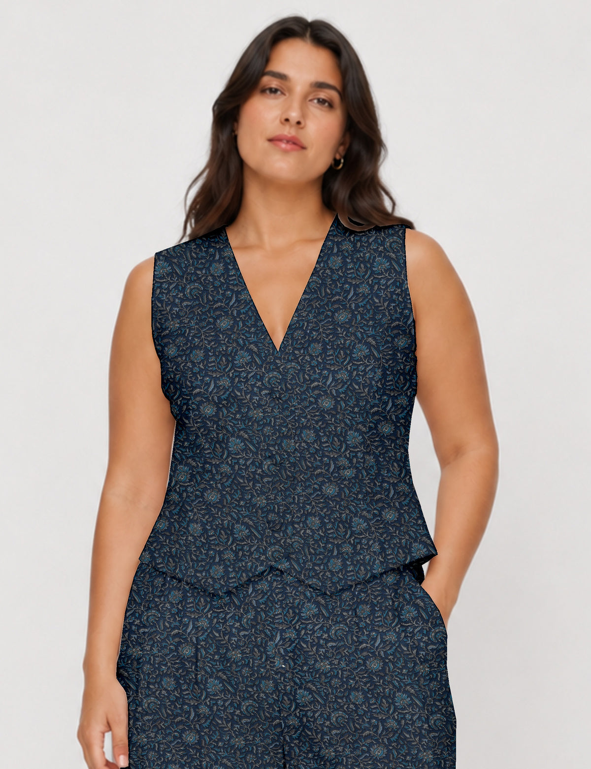 Women's fitted waistcoat with V-neck, single-breasted button closure, tailored silhouette, and pointed hem in sustainable fashion.
