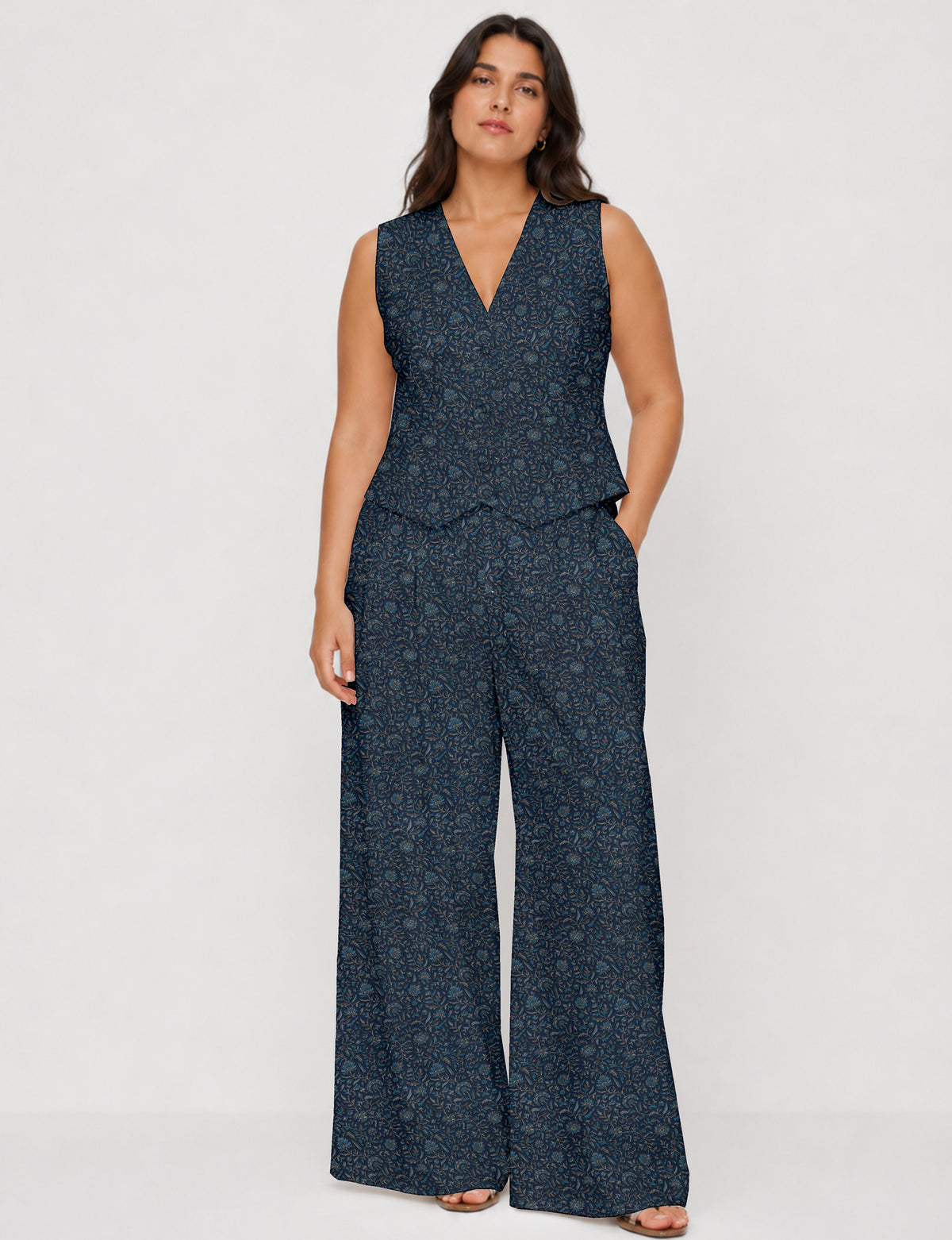 Women's tailored waistcoat set with a sleeveless V-neck button-front waistcoat and high-rise wide leg trousers in a coordinated matching outfit.
