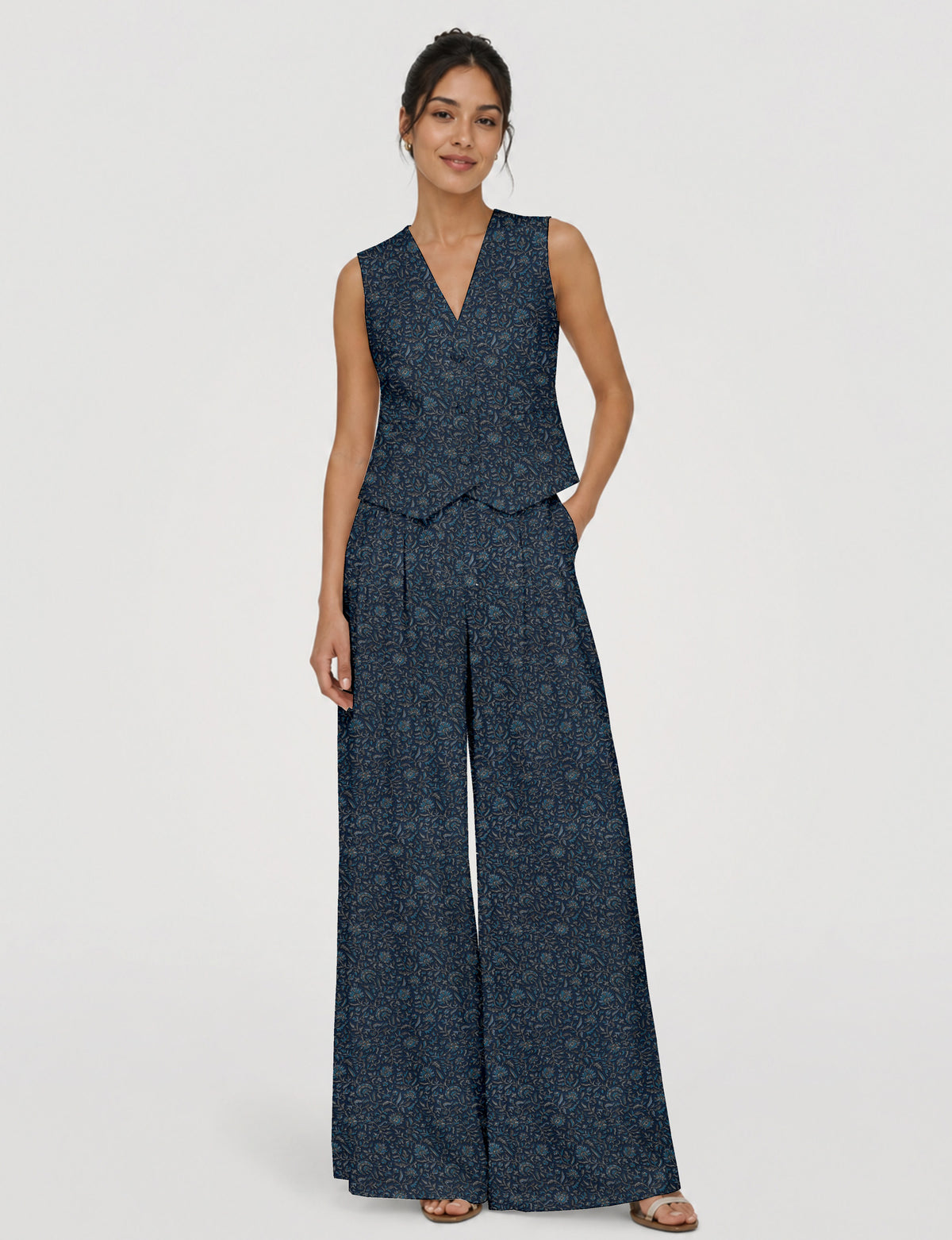 Women's tailored waistcoat set with a sleeveless V-neck button-front waistcoat and high-rise wide leg trousers in a coordinated matching outfit.