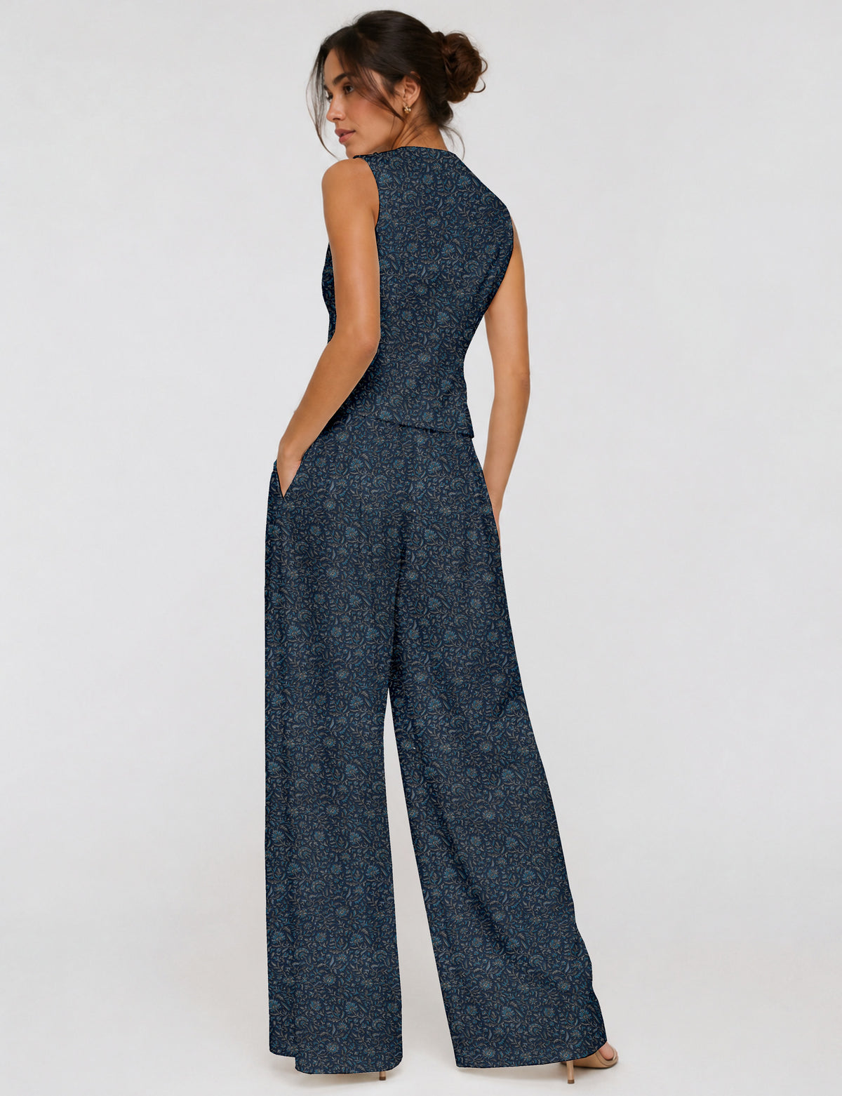 Women's tailored waistcoat set with a sleeveless V-neck button-front waistcoat and high-rise wide leg trousers in a coordinated matching outfit.