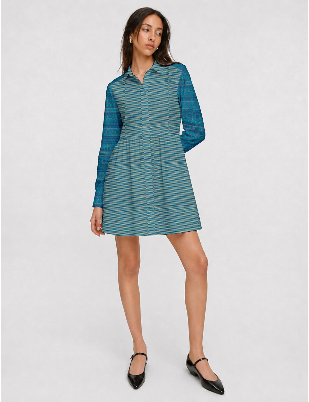 Short shirt dress with a relaxed A-line silhouette, point collar, partial button placket, gathered waist, side pockets, and full-length cuffed sleeves.