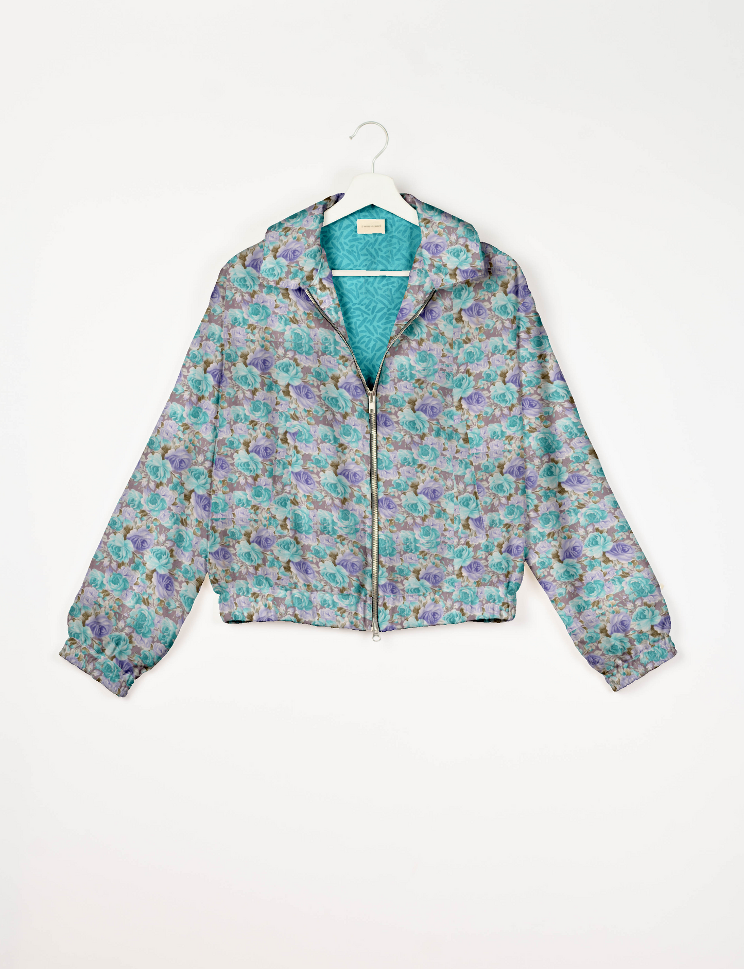 Stylish BOMBER JACKET, an upcycled clothing masterpiece with a cute cropped shape, elasticated details, and detachable metallic zipper. Contrast sari print lining adds a unique touch. Explore sustainable and eco-friendly fashion.