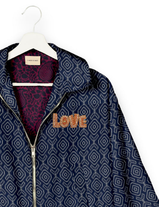 Love Bomber Jacket made from recycled fabric, featuring hand-stitched Aari embroidery. A unique piece of zero-waste clothing, part of the circular fashion movement. Designed with upcycled materials for a stylish yet environmentally friendly clothing choice.