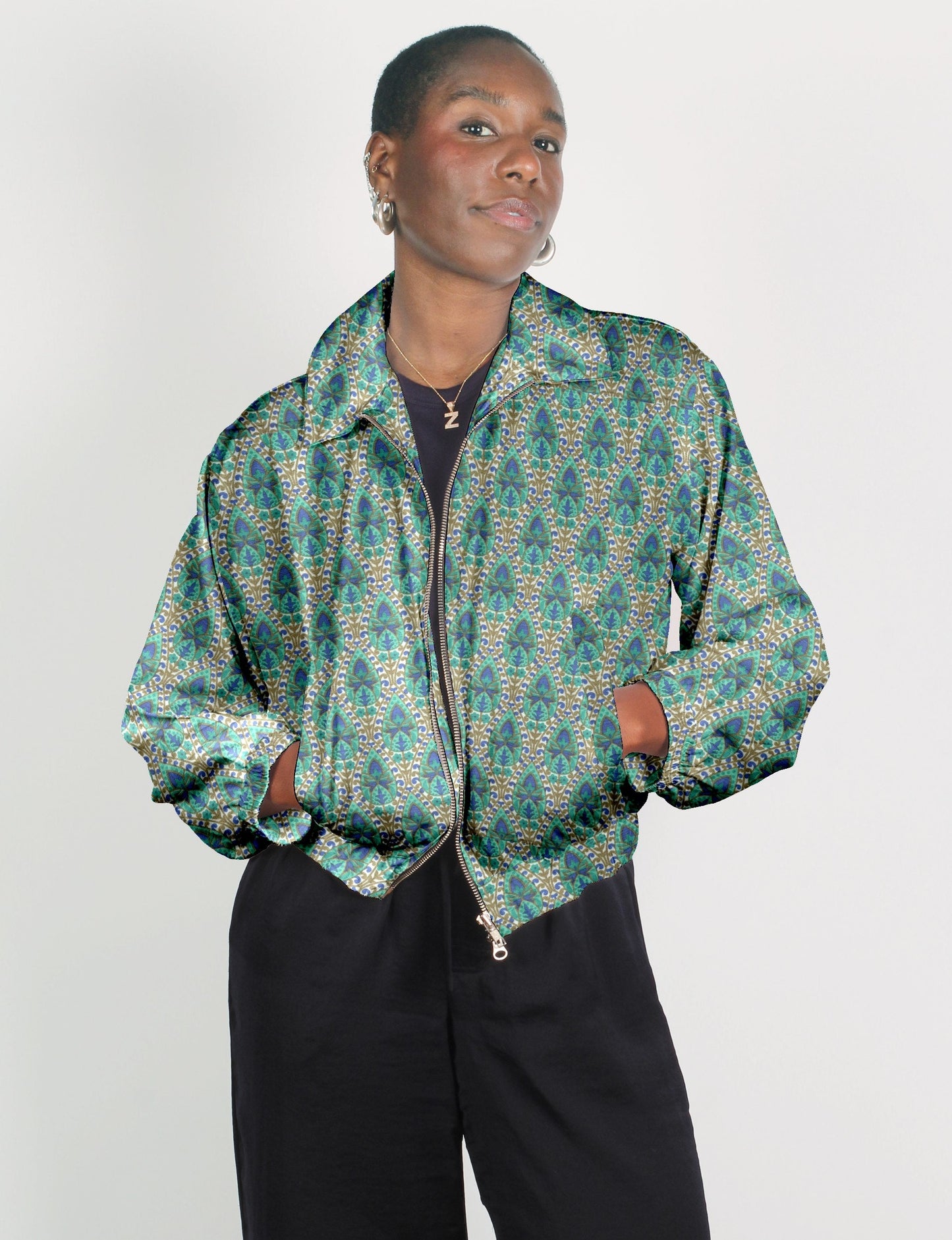 Upcycled Bomber Jacket made from recycled sari materials, featuring a cute cropped shape, elasticated hem and cuffs, and contrast sari print lining. Sustainable apparel promoting eco-friendly fashion and ethical clothing.