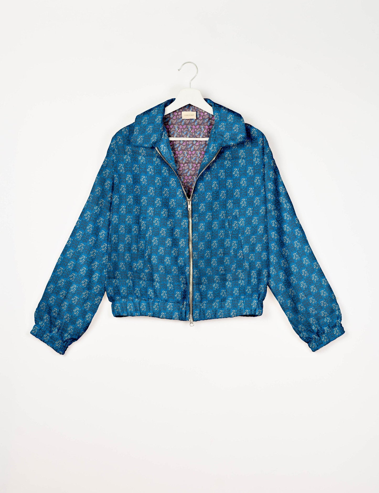 Upcycled Bomber Jacket made from recycled sari materials, featuring a cute cropped shape, elasticated hem and cuffs, and contrast sari print lining. Sustainable apparel promoting eco-friendly fashion and ethical clothing.