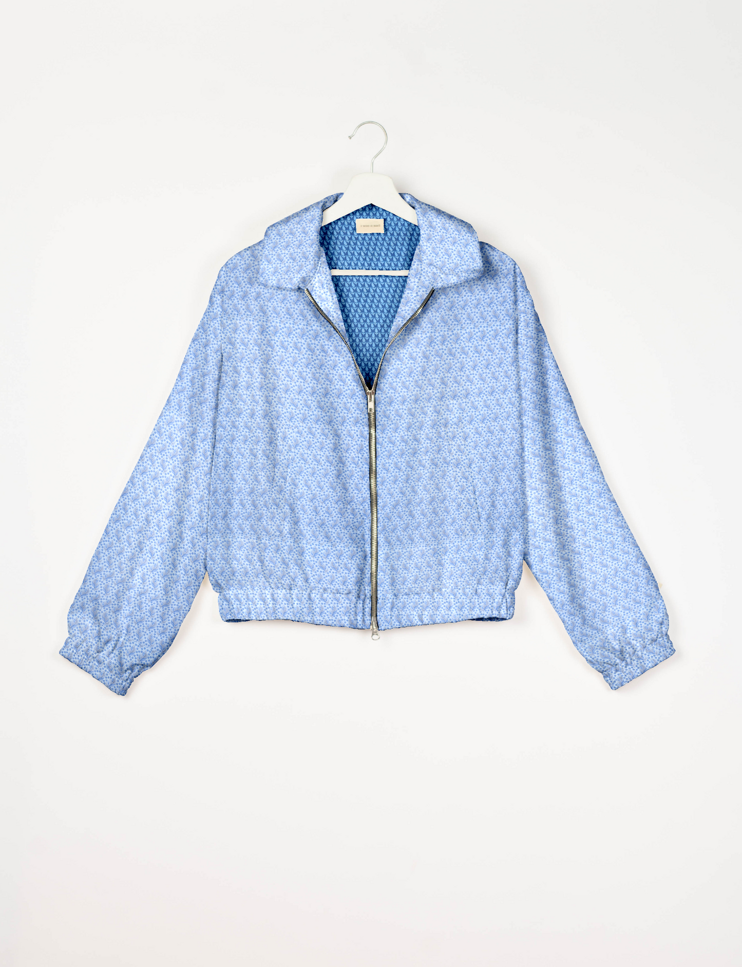 Upcycled Bomber Jacket made from recycled sari materials, featuring a cute cropped shape, elasticated hem and cuffs, and contrast sari print lining. Sustainable apparel promoting eco-friendly fashion and ethical clothing.