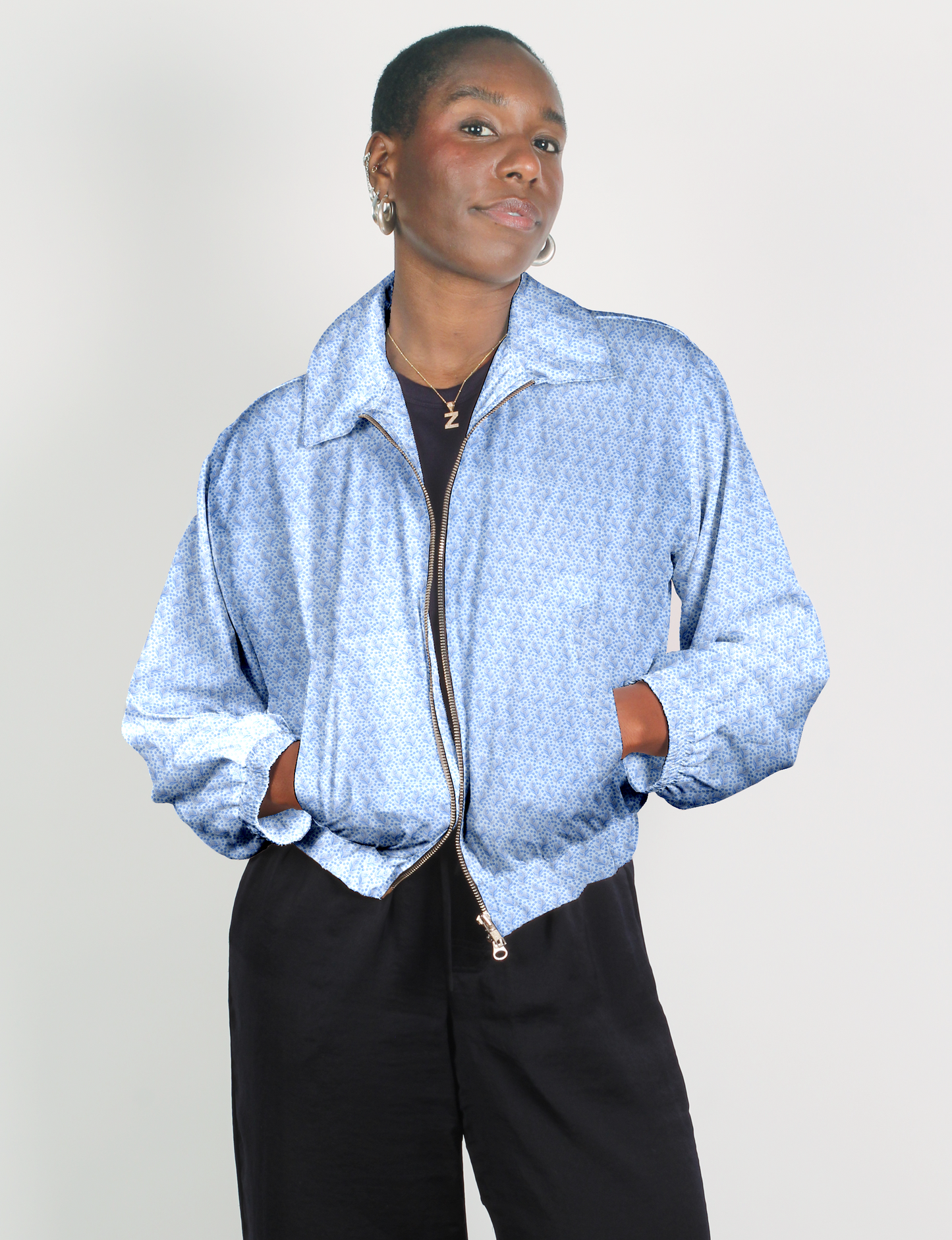 Upcycled Bomber Jacket made from recycled sari materials, featuring a cute cropped shape, elasticated hem and cuffs, and contrast sari print lining. Sustainable apparel promoting eco-friendly fashion and ethical clothing.