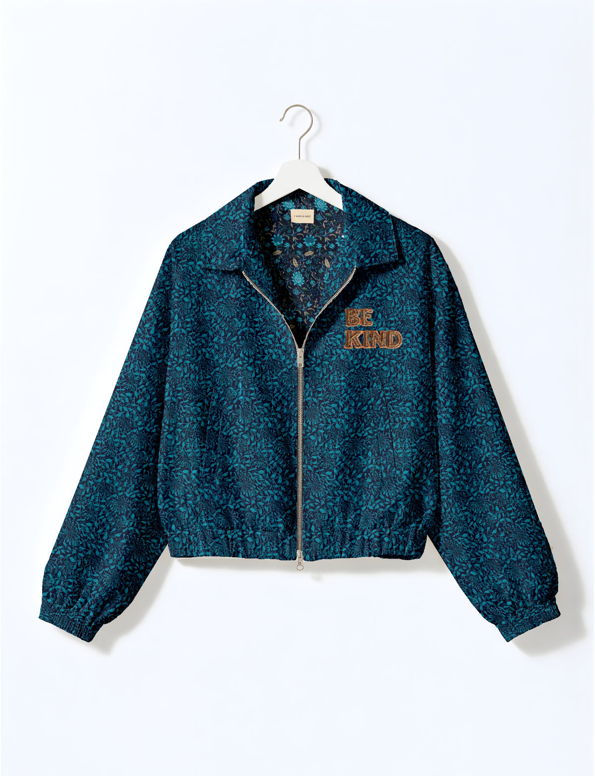 BE KIND Bomber jacket made from upcycled sari fabric with handcrafted Aari embroidery by female artisans.