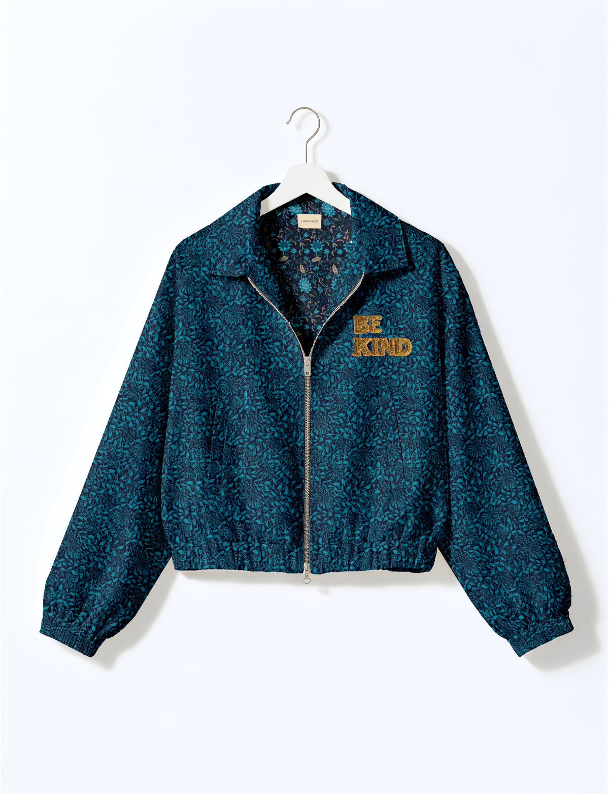BE KIND Bomber jacket made from upcycled sari fabric with handcrafted Aari embroidery by female artisans.