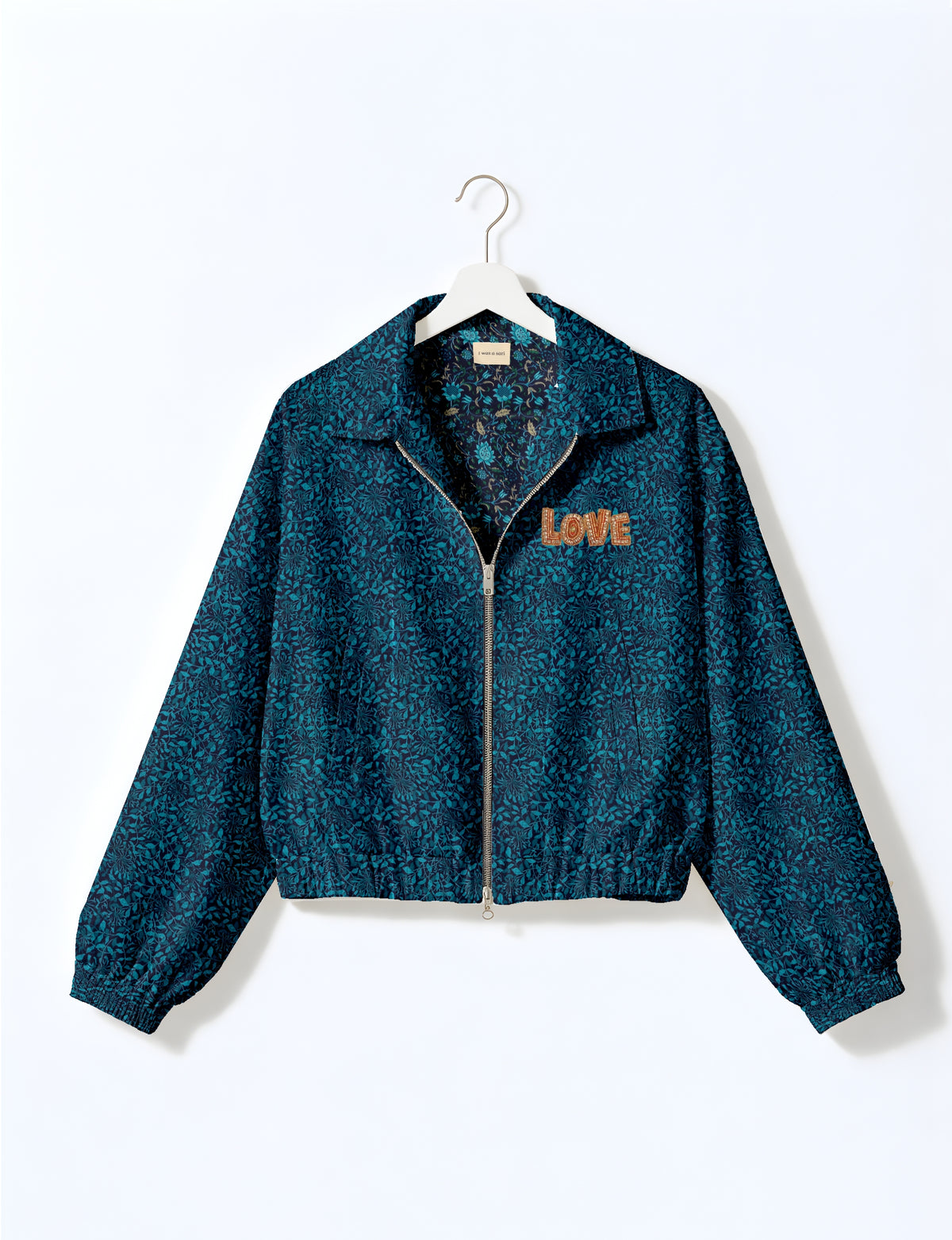 Love Bomber Jacket made from recycled fabric, featuring hand-stitched Aari embroidery. A unique piece of zero-waste clothing, part of the circular fashion movement. Designed with upcycled materials for a stylish yet environmentally friendly clothing choice.
