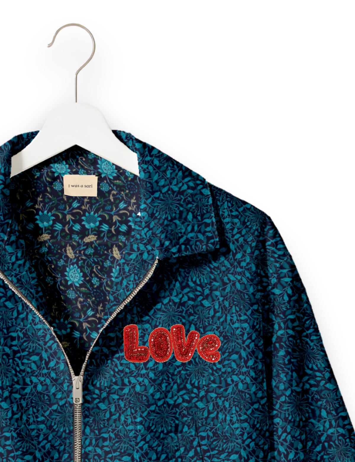 Love Bomber Jacket made from recycled fabric, featuring hand-stitched Aari embroidery. A unique piece of zero-waste clothing, part of the circular fashion movement. Designed with upcycled materials for a stylish yet environmentally friendly clothing choice.