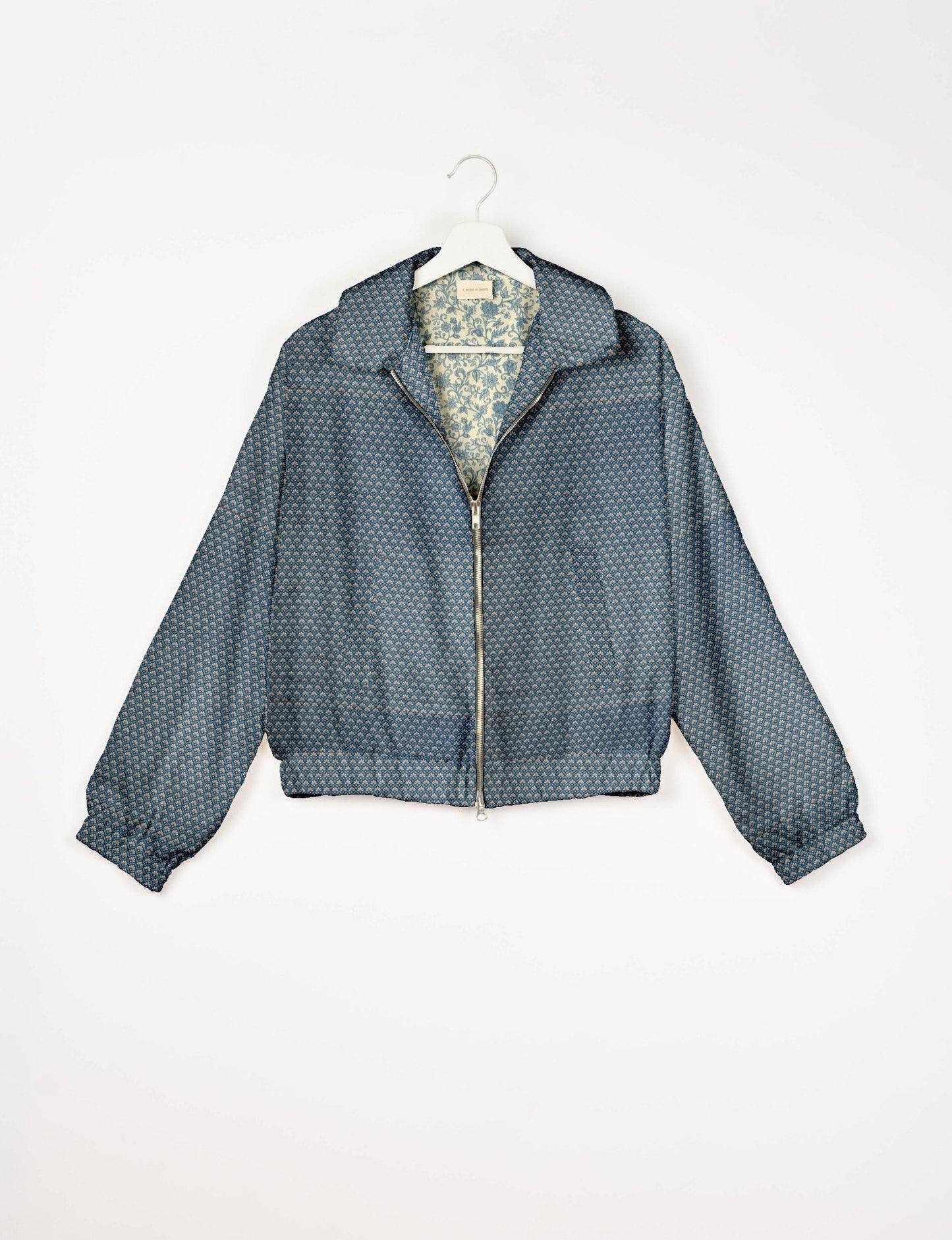 Upcycled Bomber Jacket made from recycled sari materials, featuring a cute cropped shape, elasticated hem and cuffs, and contrast sari print lining. Sustainable apparel promoting eco-friendly fashion and ethical clothing.