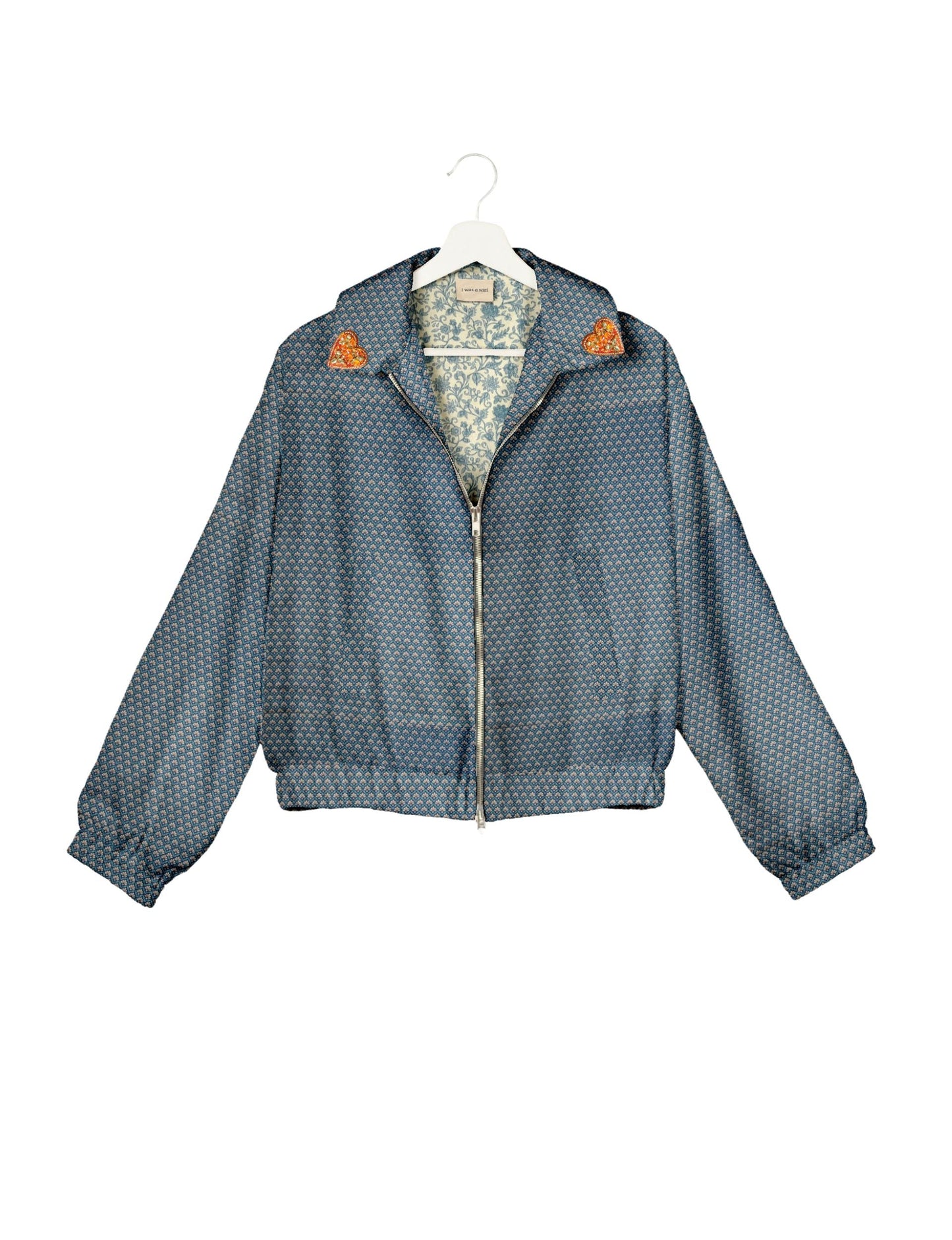 Make a bold statement with our Heart Drop Earrings, a symbol of conscious luxury and ethical fashion. Handcrafted using the intricate Aari embroidery technique, these earrings are made from upcycled sari fabric, embracing slow fashion and zero waste clothing. Elevate your look with sustainable apparel that supports fair trade fashion while reducing textile waste. Choose eco-friendly fashion that speaks of love, artistry, and responsibility.