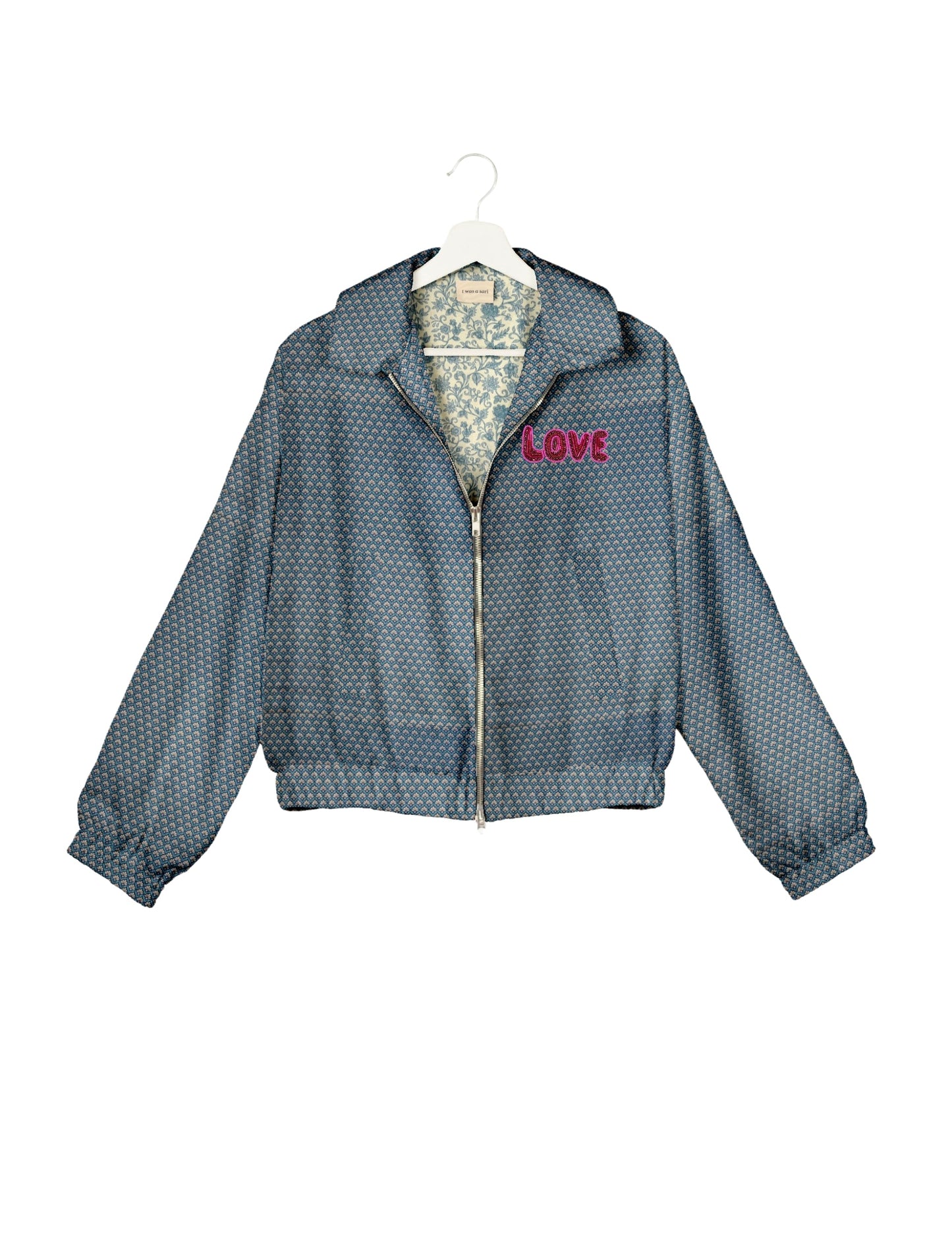 Love Bomber Jacket made from recycled fabric, featuring hand-stitched Aari embroidery. A unique piece of zero-waste clothing, part of the circular fashion movement. Designed with upcycled materials for a stylish yet environmentally friendly clothing choice.