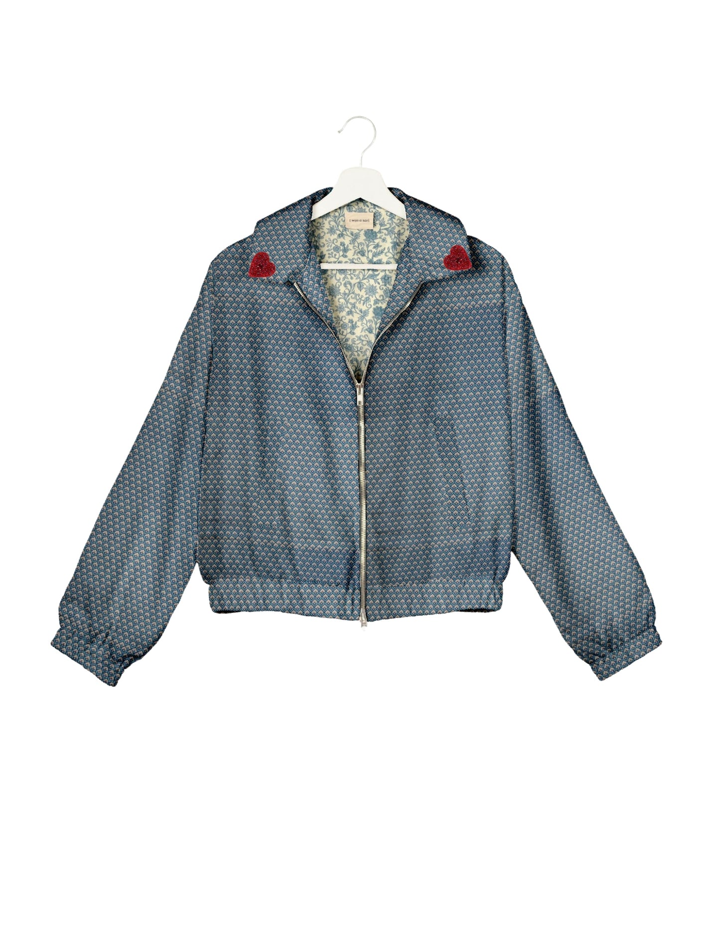 Make a bold statement with our Heart Drop Earrings, a symbol of conscious luxury and ethical fashion. Handcrafted using the intricate Aari embroidery technique, these earrings are made from upcycled sari fabric, embracing slow fashion and zero waste clothing. Elevate your look with sustainable apparel that supports fair trade fashion while reducing textile waste. Choose eco-friendly fashion that speaks of love, artistry, and responsibility.