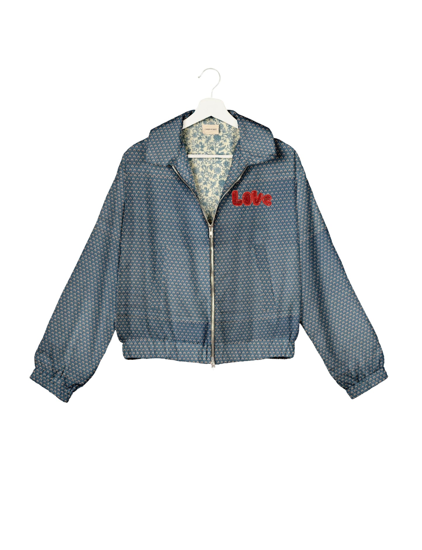 Love Bomber Jacket made from recycled fabric, featuring hand-stitched Aari embroidery. A unique piece of zero-waste clothing, part of the circular fashion movement. Designed with upcycled materials for a stylish yet environmentally friendly clothing choice.