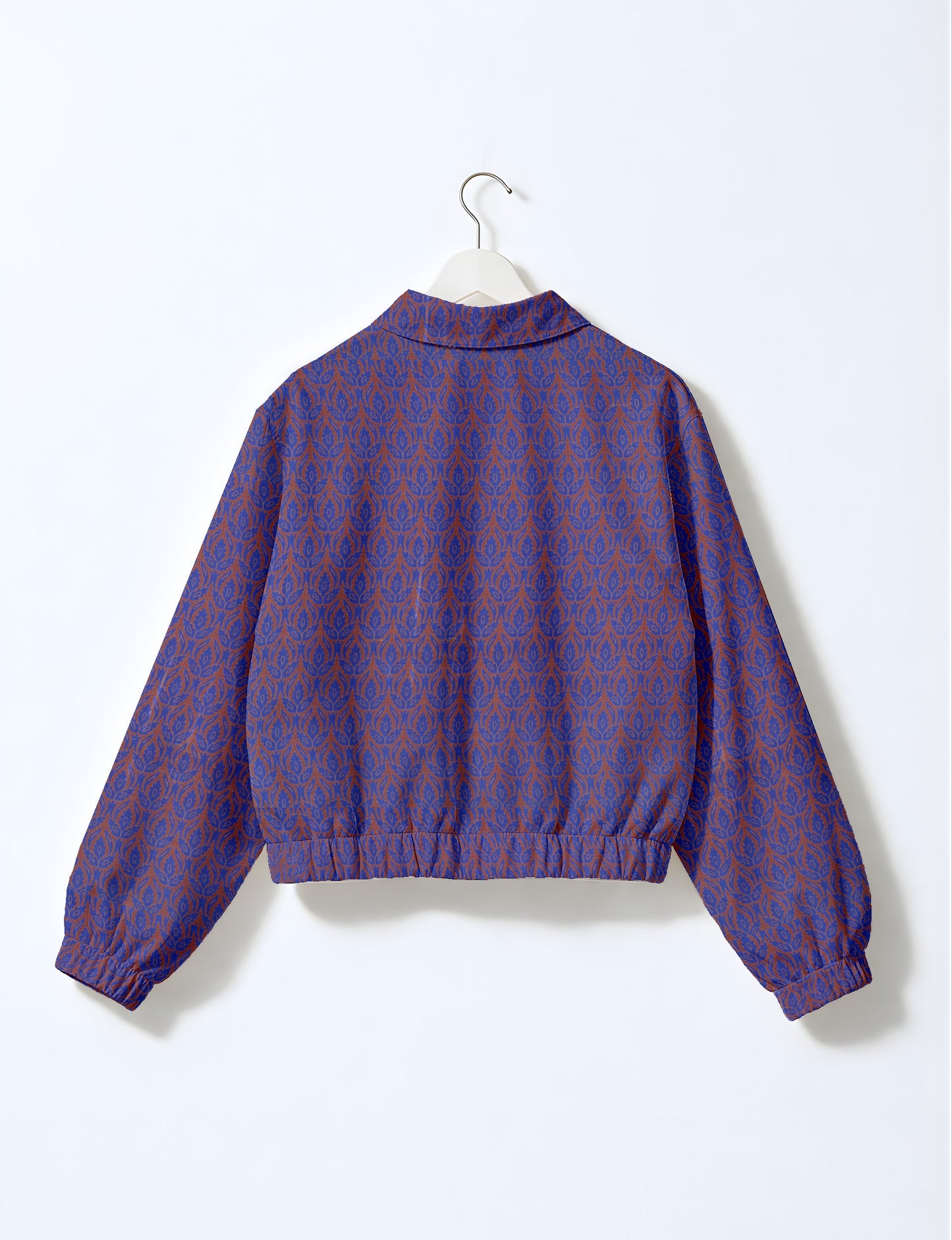 Upcycled Bomber Jacket made from recycled sari materials, featuring a cute cropped shape, elasticated hem and cuffs, and contrast sari print lining. Sustainable apparel promoting eco-friendly fashion and ethical clothing.