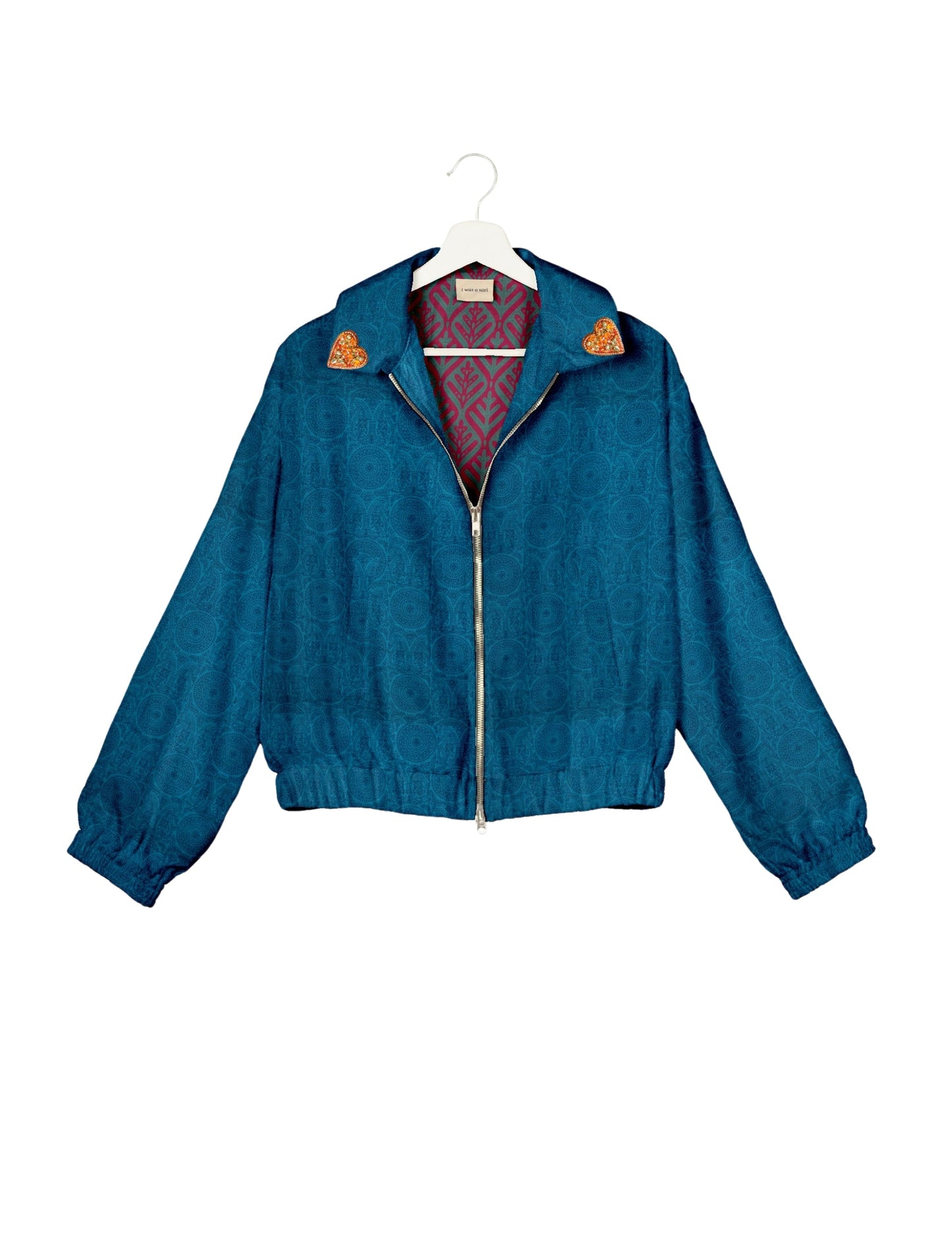 Make a bold statement with our Heart Drop Earrings, a symbol of conscious luxury and ethical fashion. Handcrafted using the intricate Aari embroidery technique, these earrings are made from upcycled sari fabric, embracing slow fashion and zero waste clothing. Elevate your look with sustainable apparel that supports fair trade fashion while reducing textile waste. Choose eco-friendly fashion that speaks of love, artistry, and responsibility.