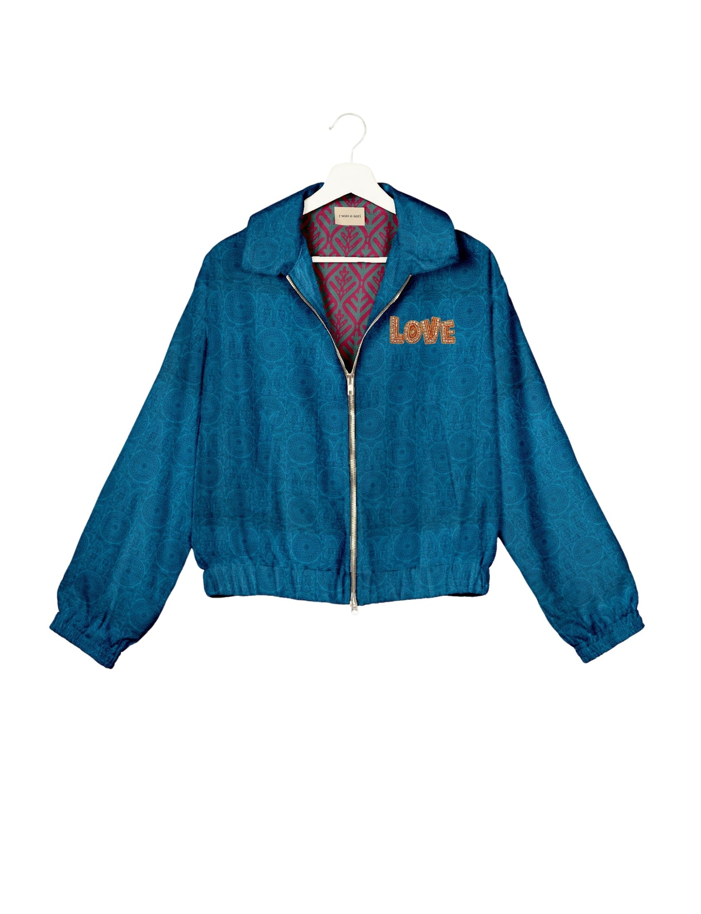 Love Bomber Jacket made from recycled fabric, featuring hand-stitched Aari embroidery. A unique piece of zero-waste clothing, part of the circular fashion movement. Designed with upcycled materials for a stylish yet environmentally friendly clothing choice.