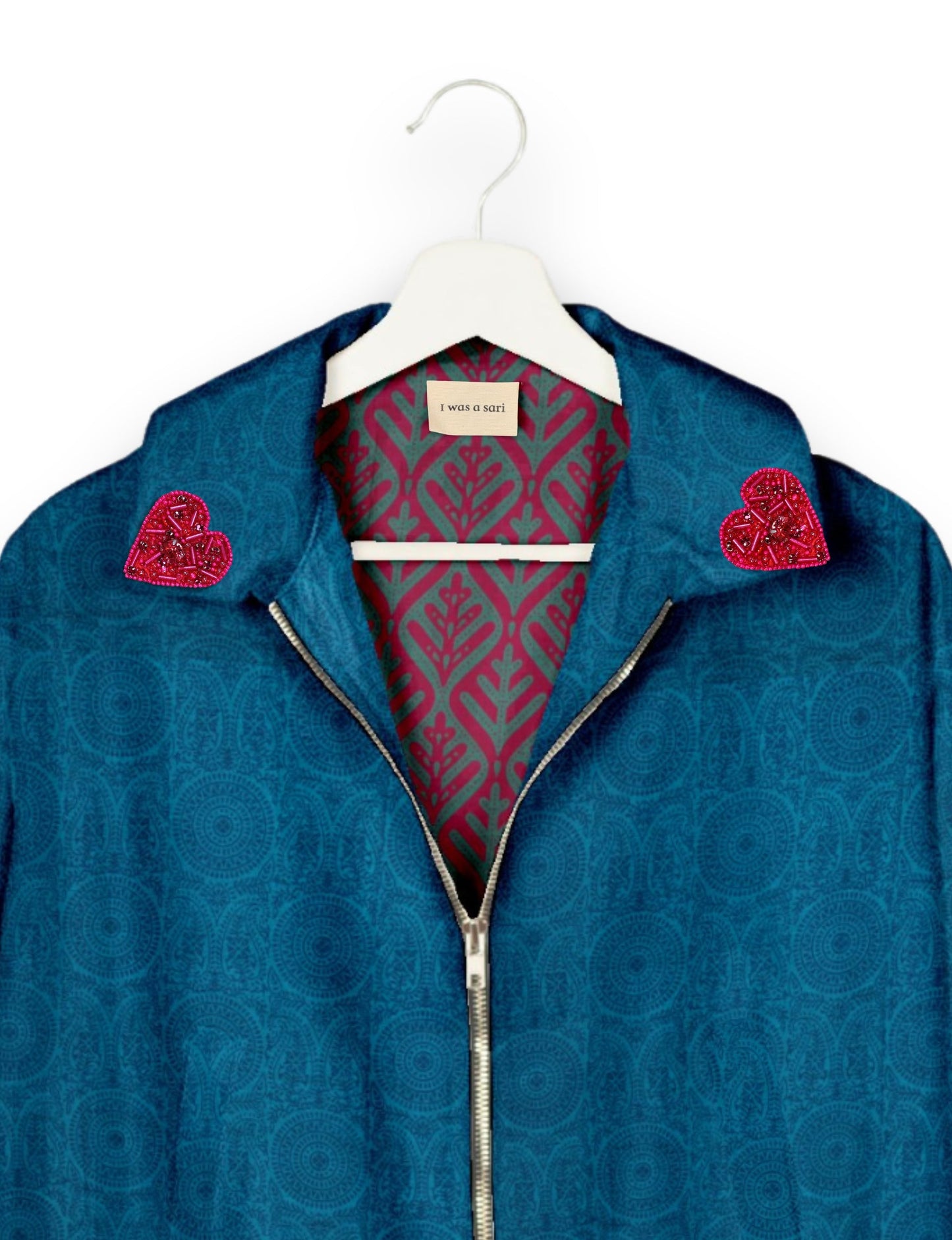 Make a bold statement with our Heart Drop Earrings, a symbol of conscious luxury and ethical fashion. Handcrafted using the intricate Aari embroidery technique, these earrings are made from upcycled sari fabric, embracing slow fashion and zero waste clothing. Elevate your look with sustainable apparel that supports fair trade fashion while reducing textile waste. Choose eco-friendly fashion that speaks of love, artistry, and responsibility.