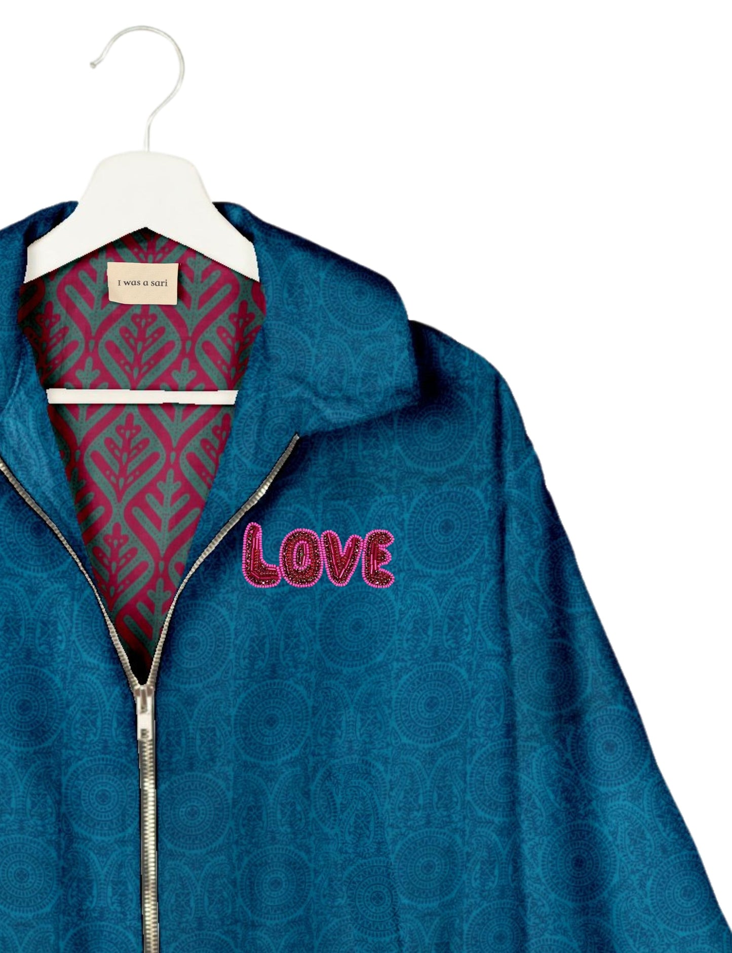 Love Bomber Jacket made from recycled fabric, featuring hand-stitched Aari embroidery. A unique piece of zero-waste clothing, part of the circular fashion movement. Designed with upcycled materials for a stylish yet environmentally friendly clothing choice.