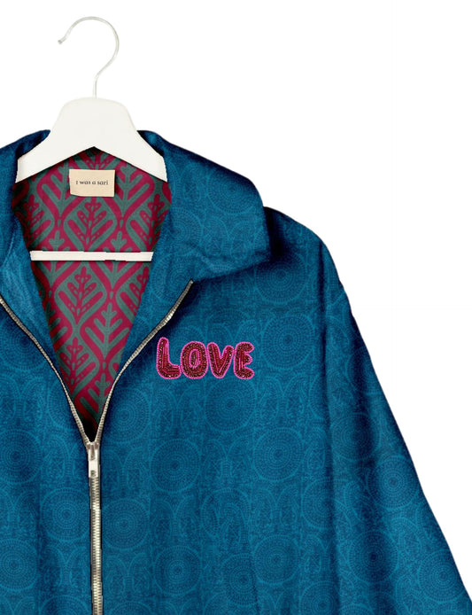 Love Bomber Jacket made from recycled fabric, featuring hand-stitched Aari embroidery. A unique piece of zero-waste clothing, part of the circular fashion movement. Designed with upcycled materials for a stylish yet environmentally friendly clothing choice.