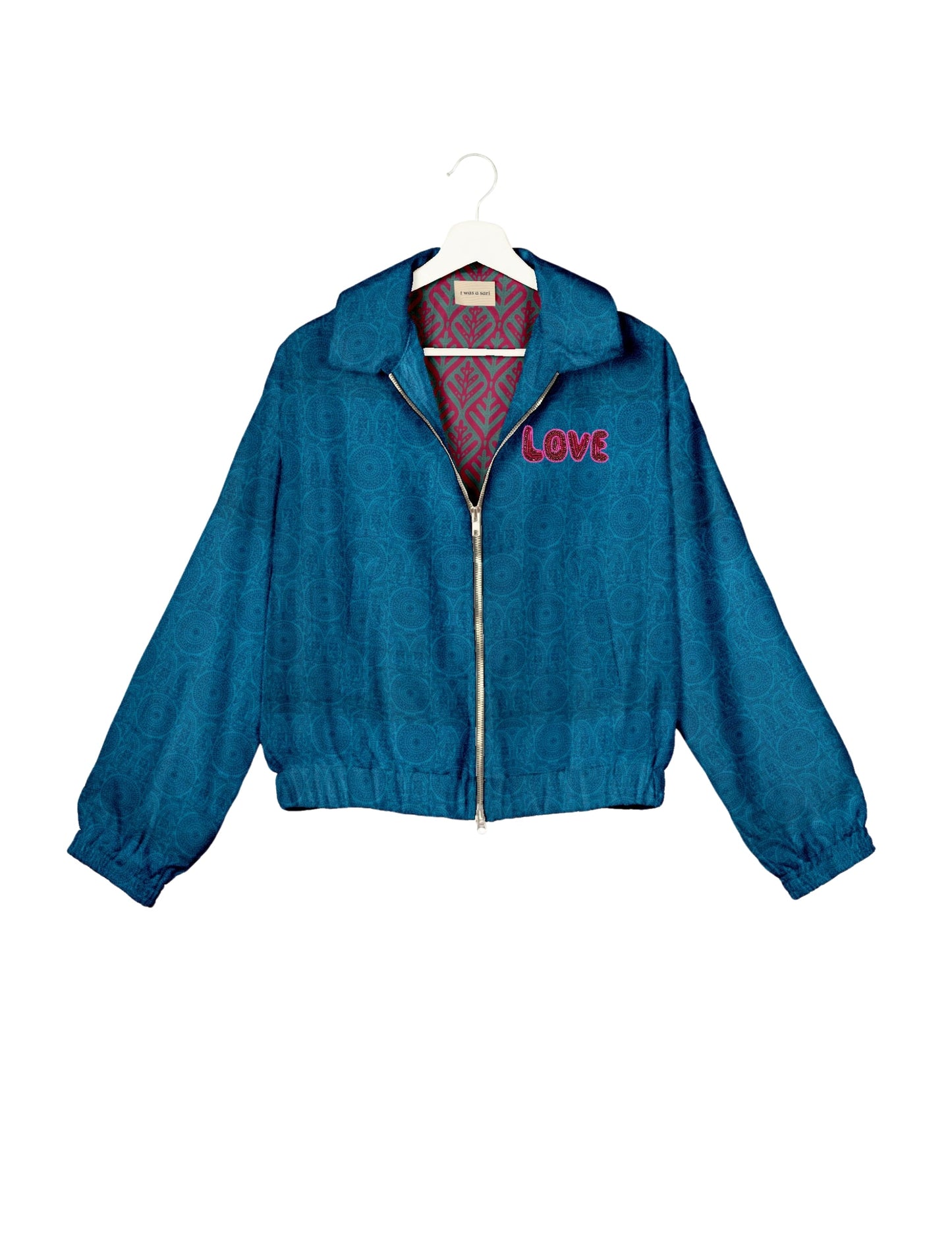 Love Bomber Jacket made from recycled fabric, featuring hand-stitched Aari embroidery. A unique piece of zero-waste clothing, part of the circular fashion movement. Designed with upcycled materials for a stylish yet environmentally friendly clothing choice.