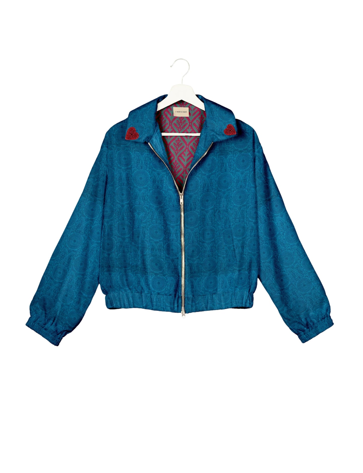 Make a bold statement with our Heart Drop Earrings, a symbol of conscious luxury and ethical fashion. Handcrafted using the intricate Aari embroidery technique, these earrings are made from upcycled sari fabric, embracing slow fashion and zero waste clothing. Elevate your look with sustainable apparel that supports fair trade fashion while reducing textile waste. Choose eco-friendly fashion that speaks of love, artistry, and responsibility.