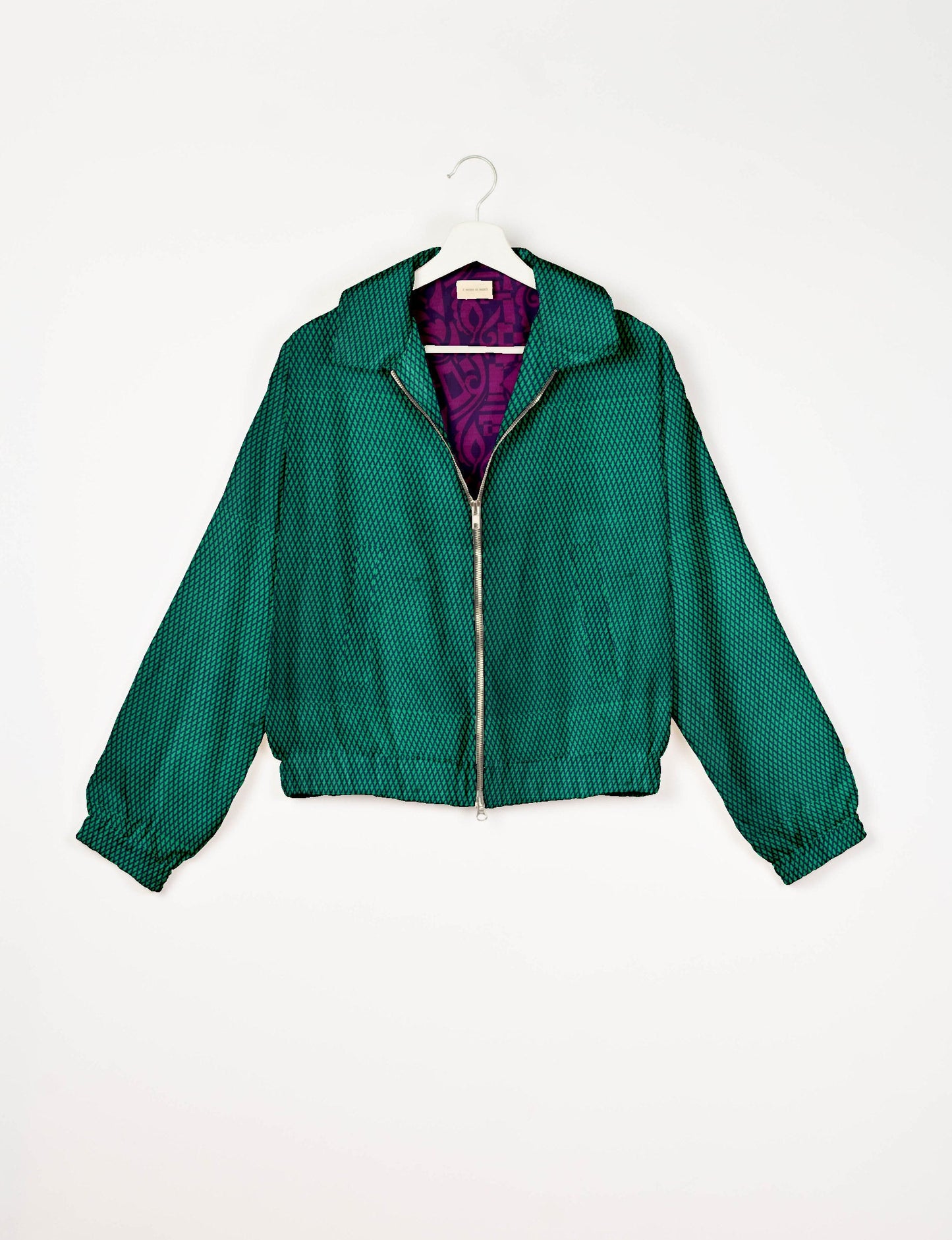 Upcycled Bomber Jacket made from recycled sari materials, featuring a cute cropped shape, elasticated hem and cuffs, and contrast sari print lining. Sustainable apparel promoting eco-friendly fashion and ethical clothing.