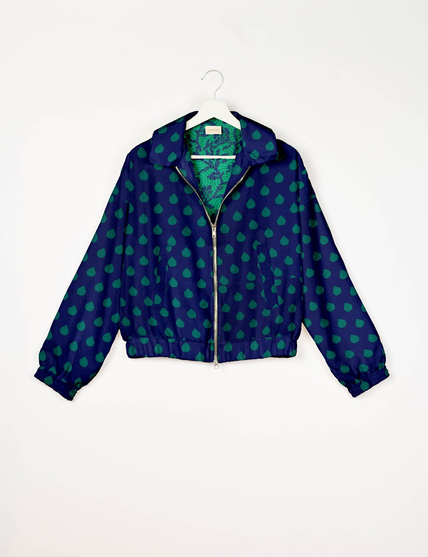 Upcycled Bomber Jacket made from recycled sari materials, featuring a cute cropped shape, elasticated hem and cuffs, and contrast sari print lining. Sustainable apparel promoting eco-friendly fashion and ethical clothing.