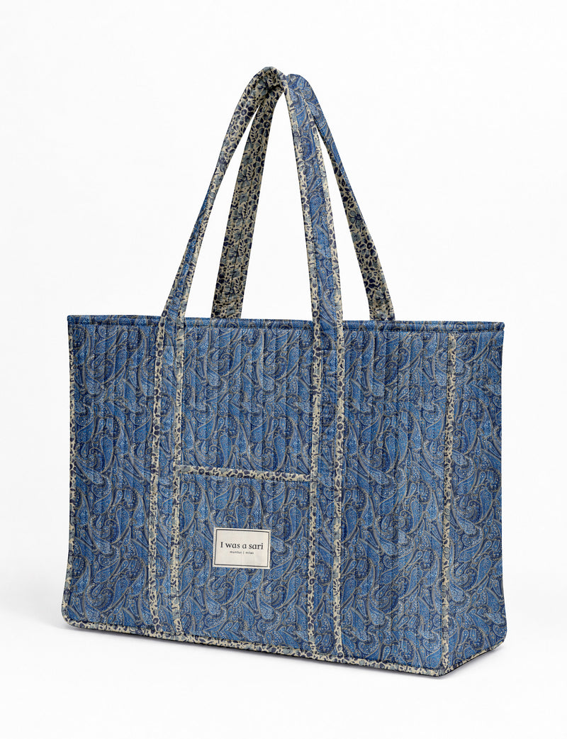 Quilted work tote bag with structured rectangular design and long shoulder straps, representing slow fashion and ethical clothing ideals, made as part of upcycled women's clothing and sustainable women's clothing using recycled fashion and earth friendly clothing practices.