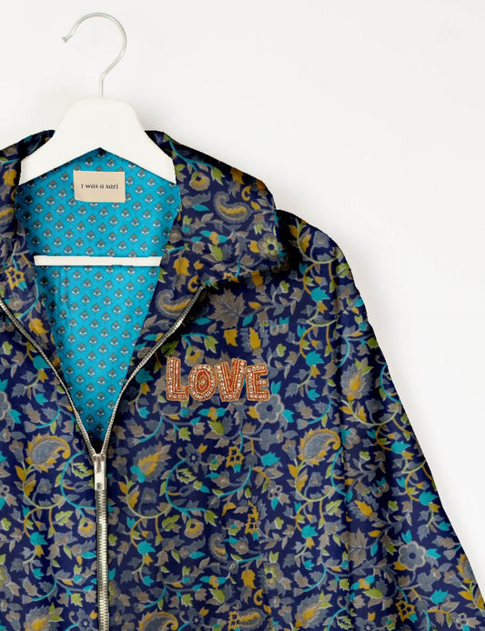 Love Bomber Jacket made from recycled fabric, featuring hand-stitched Aari embroidery. A unique piece of zero-waste clothing, part of the circular fashion movement. Designed with upcycled materials for a stylish yet environmentally friendly clothing choice.