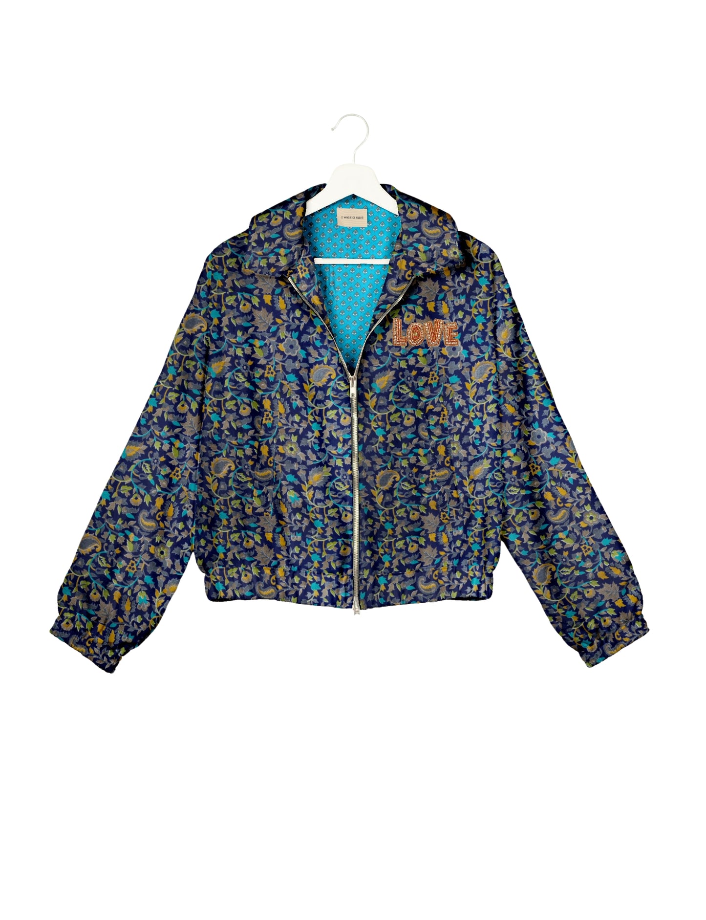 Love Bomber Jacket made from recycled fabric, featuring hand-stitched Aari embroidery. A unique piece of zero-waste clothing, part of the circular fashion movement. Designed with upcycled materials for a stylish yet environmentally friendly clothing choice.