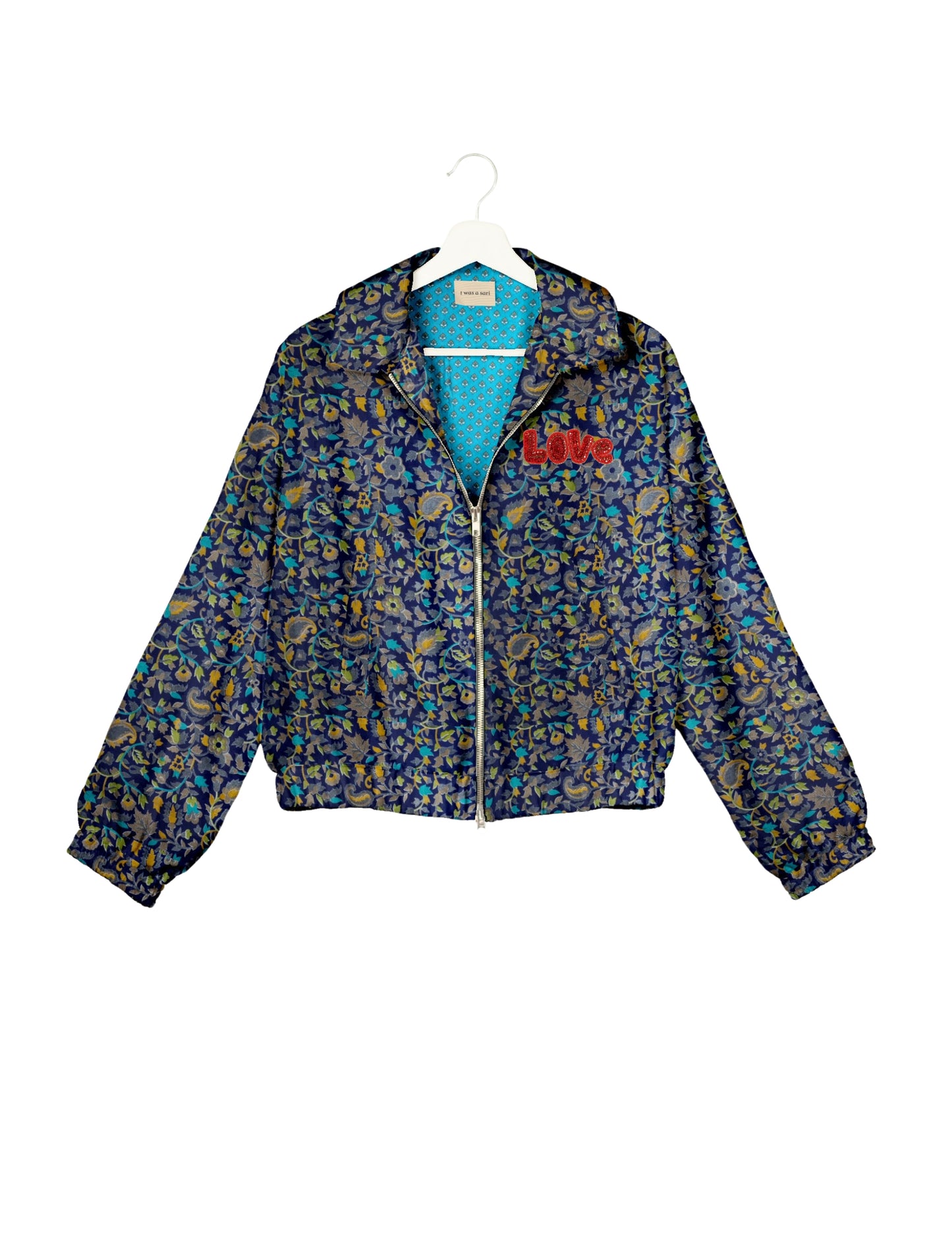Love Bomber Jacket made from recycled fabric, featuring hand-stitched Aari embroidery. A unique piece of zero-waste clothing, part of the circular fashion movement. Designed with upcycled materials for a stylish yet environmentally friendly clothing choice.