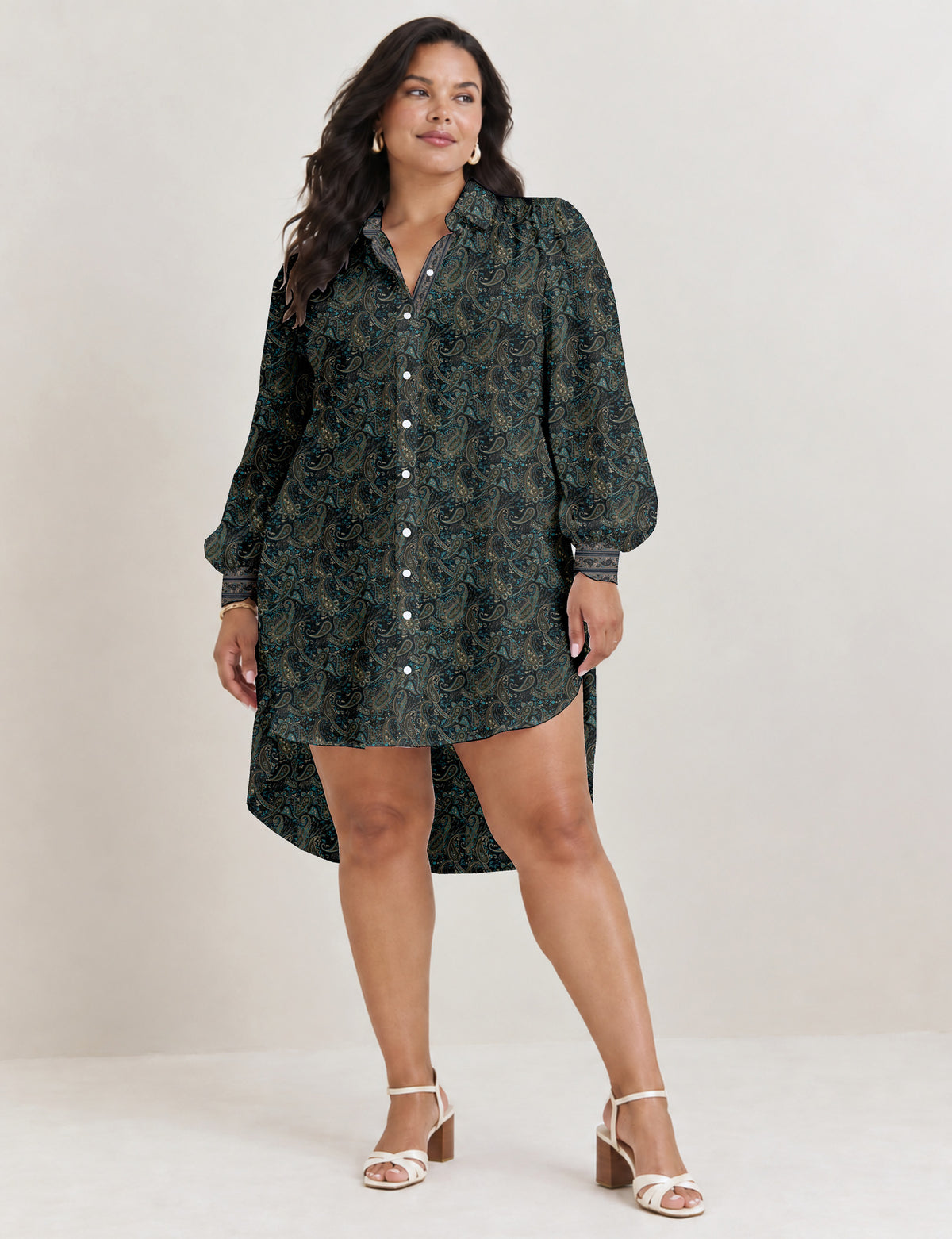 High low shirt with a relaxed fit, button-down front, classic collar, gathered shoulders and full-length blouson sleeves.