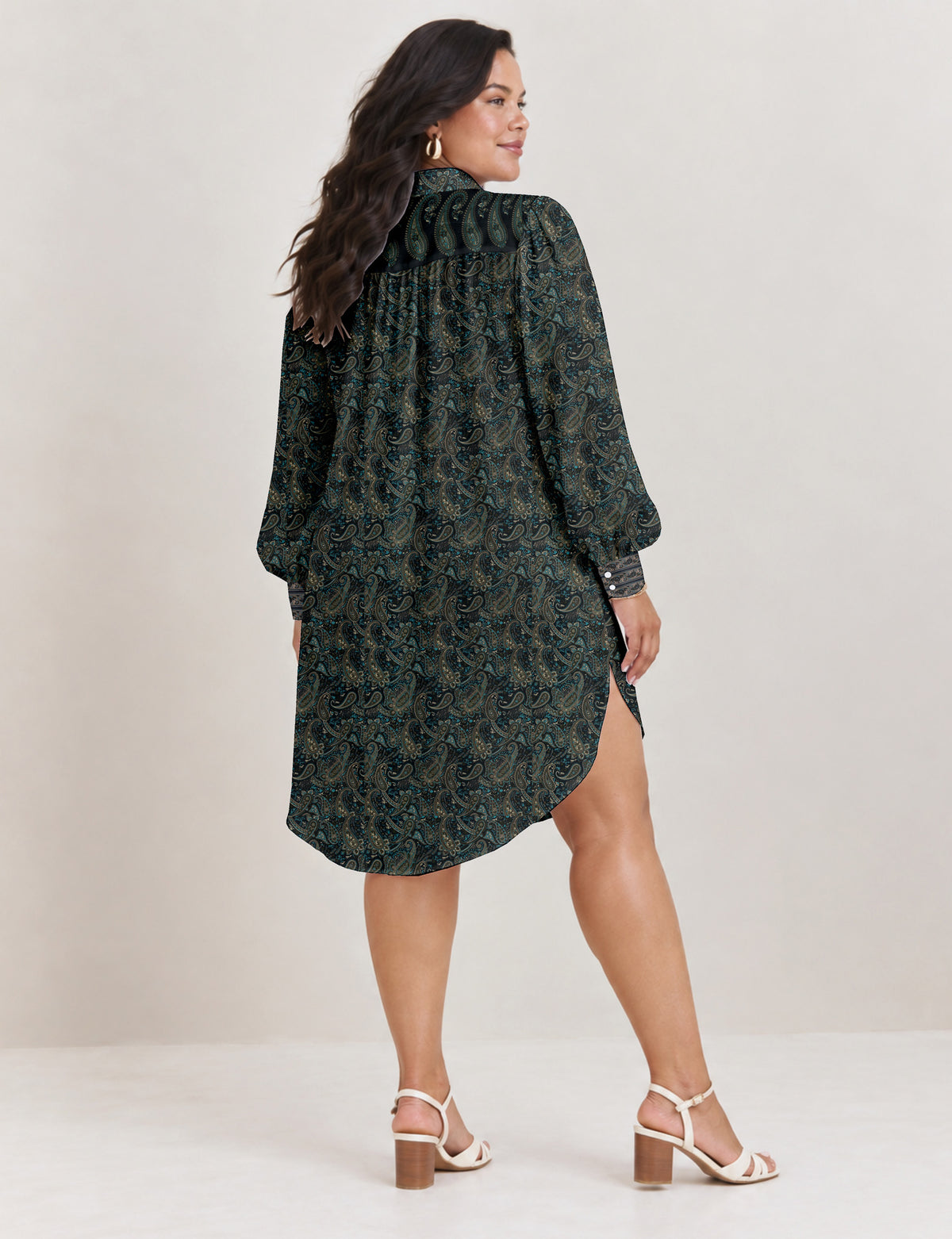 High low shirt with a relaxed fit, button-down front, classic collar, gathered shoulders and full-length blouson sleeves.