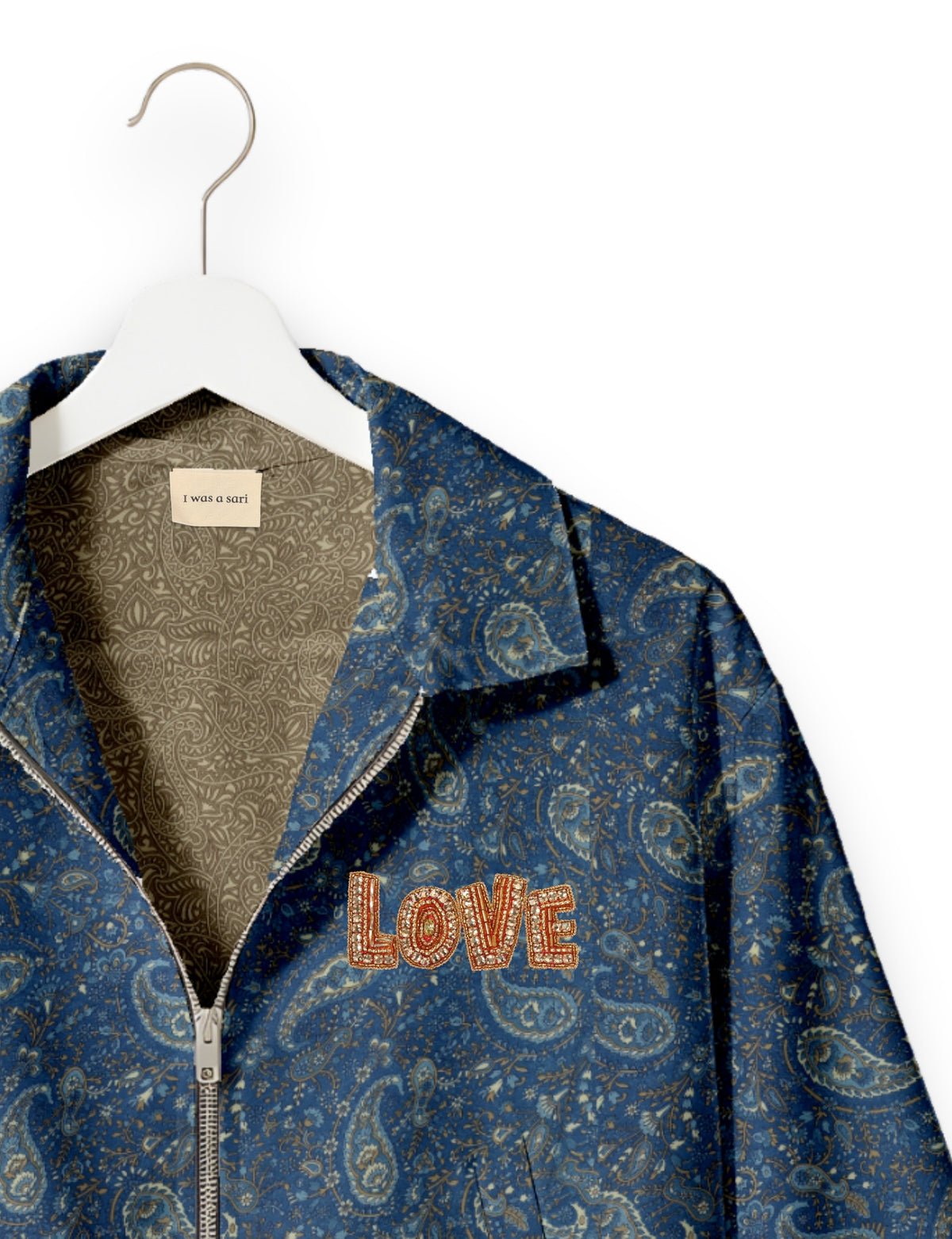 Love Bomber Jacket made from recycled fabric, featuring hand-stitched Aari embroidery. A unique piece of zero-waste clothing, part of the circular fashion movement. Designed with upcycled materials for a stylish yet environmentally friendly clothing choice.