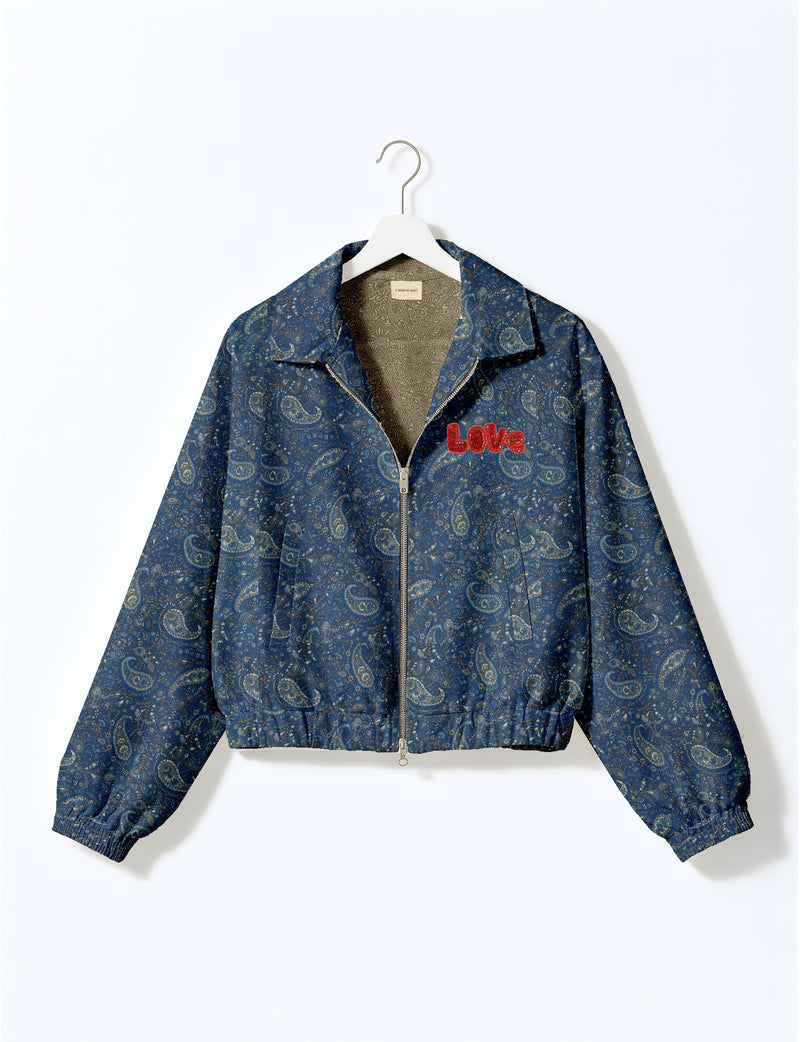Love Bomber Jacket made from recycled fabric, featuring hand-stitched Aari embroidery. A unique piece of zero-waste clothing, part of the circular fashion movement. Designed with upcycled materials for a stylish yet environmentally friendly clothing choice.