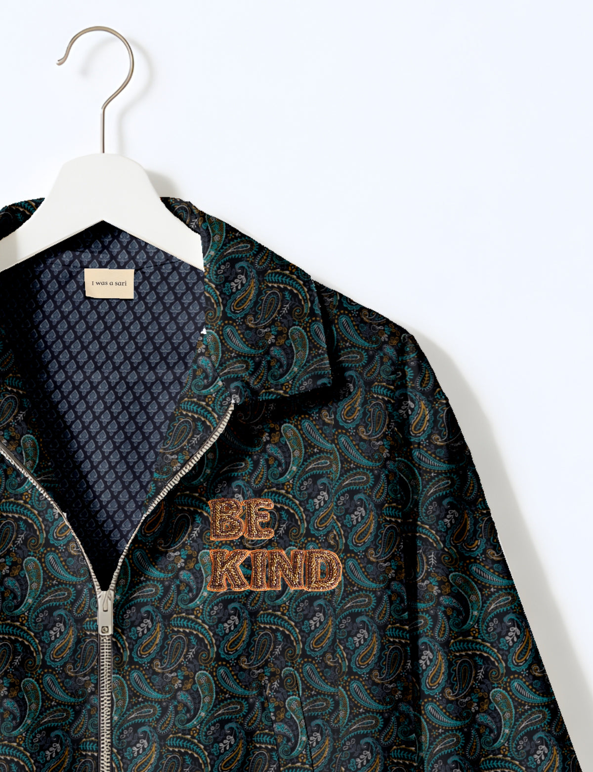BE KIND Bomber jacket made from upcycled sari fabric with handcrafted Aari embroidery by female artisans.