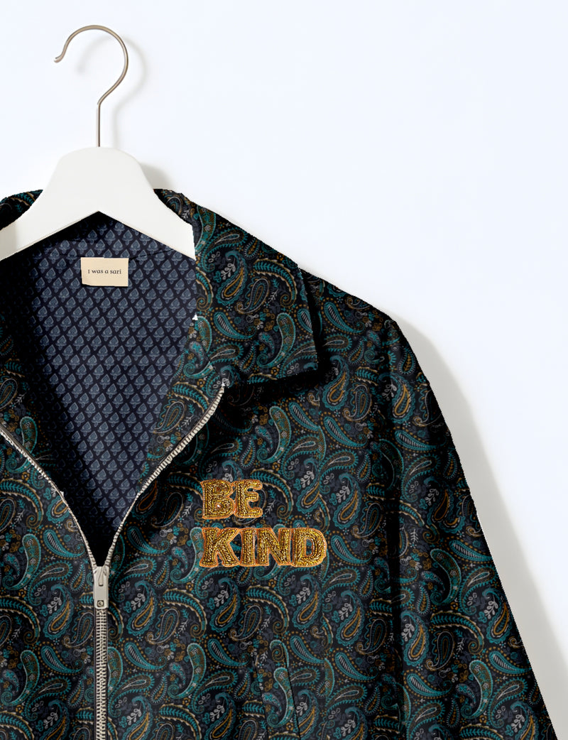 BE KIND Bomber jacket made from upcycled sari fabric with handcrafted Aari embroidery by female artisans.