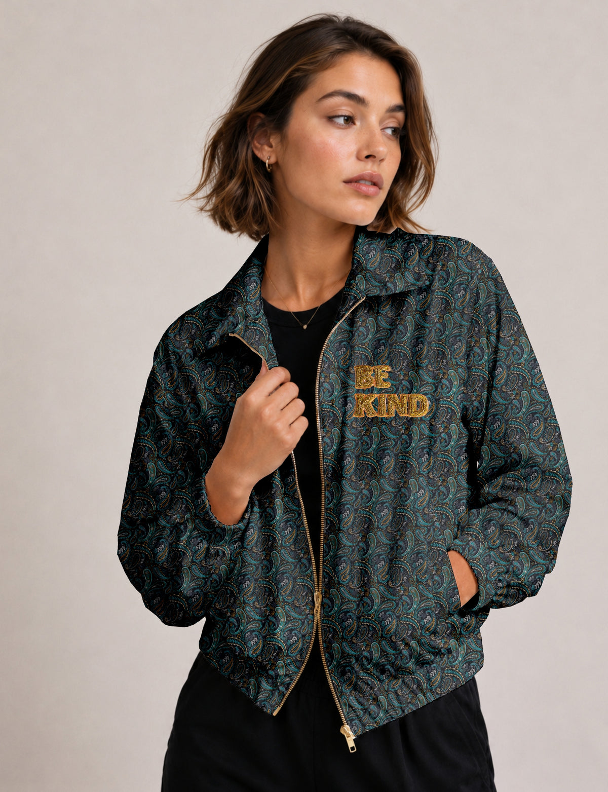 BE KIND Bomber jacket made from upcycled sari fabric with handcrafted Aari embroidery by female artisans.