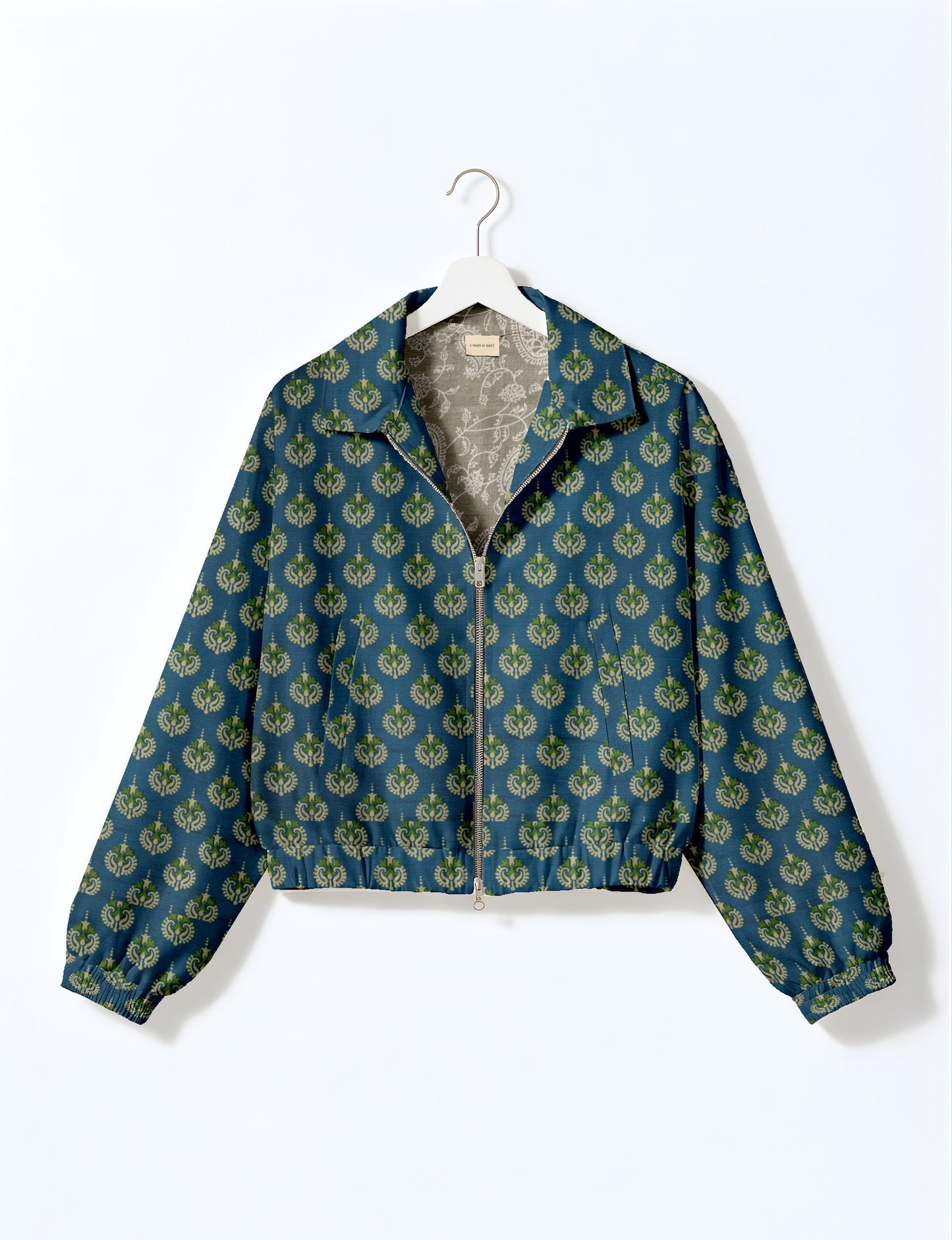 Upcycled Bomber Jacket made from recycled sari materials, featuring a cute cropped shape, elasticated hem and cuffs, and contrast sari print lining. Sustainable apparel promoting eco-friendly fashion and ethical clothing.