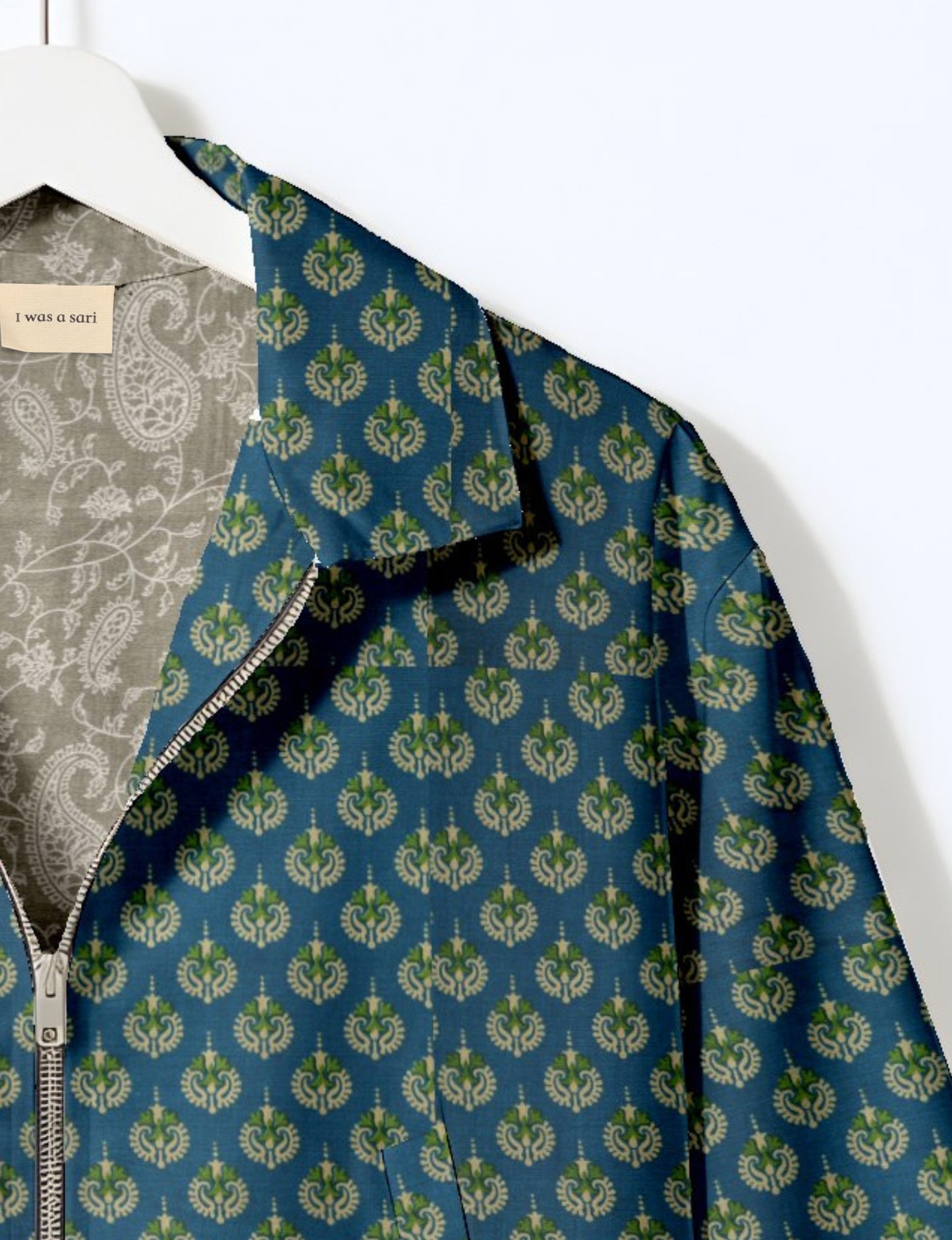 Upcycled Bomber Jacket made from recycled sari materials, featuring a cute cropped shape, elasticated hem and cuffs, and contrast sari print lining. Sustainable apparel promoting eco-friendly fashion and ethical clothing.