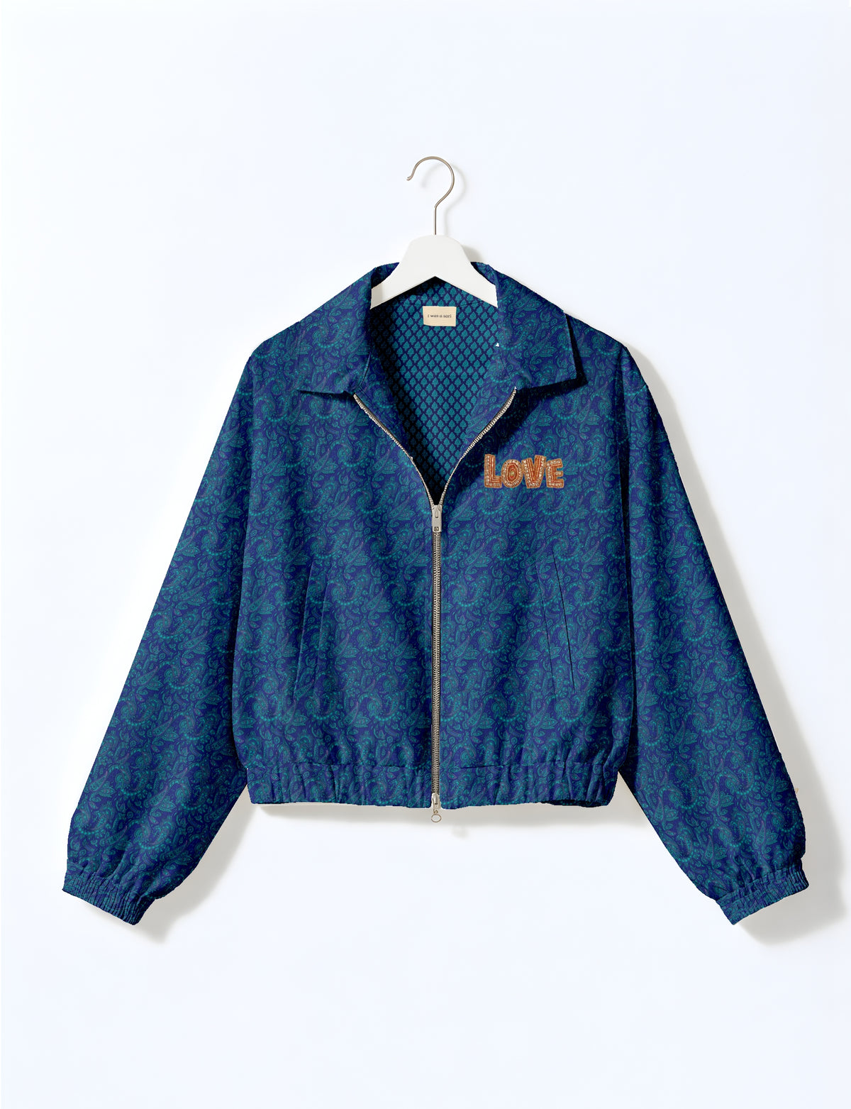 Love Bomber Jacket made from recycled fabric, featuring hand-stitched Aari embroidery. A unique piece of zero-waste clothing, part of the circular fashion movement. Designed with upcycled materials for a stylish yet environmentally friendly clothing choice.