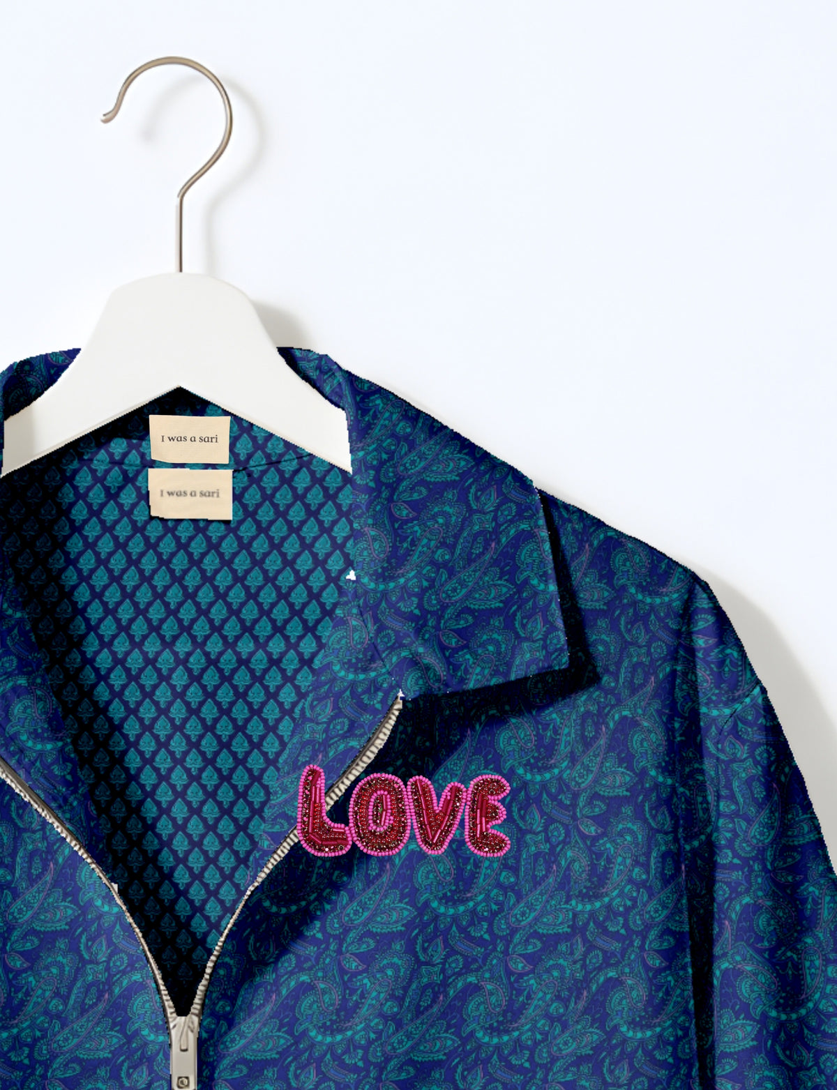 Love Bomber Jacket made from recycled fabric, featuring hand-stitched Aari embroidery. A unique piece of zero-waste clothing, part of the circular fashion movement. Designed with upcycled materials for a stylish yet environmentally friendly clothing choice.