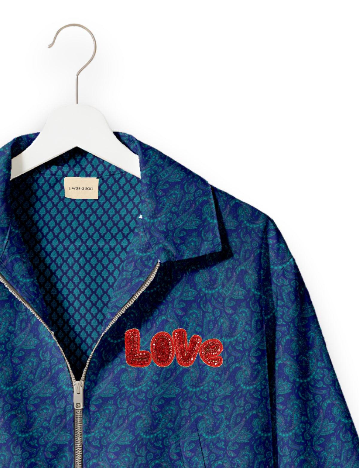 Love Bomber Jacket made from recycled fabric, featuring hand-stitched Aari embroidery. A unique piece of zero-waste clothing, part of the circular fashion movement. Designed with upcycled materials for a stylish yet environmentally friendly clothing choice.