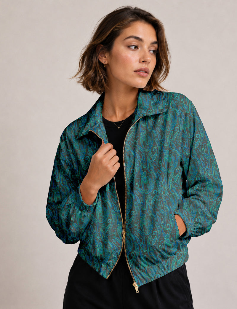 Brown floral bomber jacket with front zipper, elastic cuffs and hem, hanging on white hanger, red floral inner lining visible