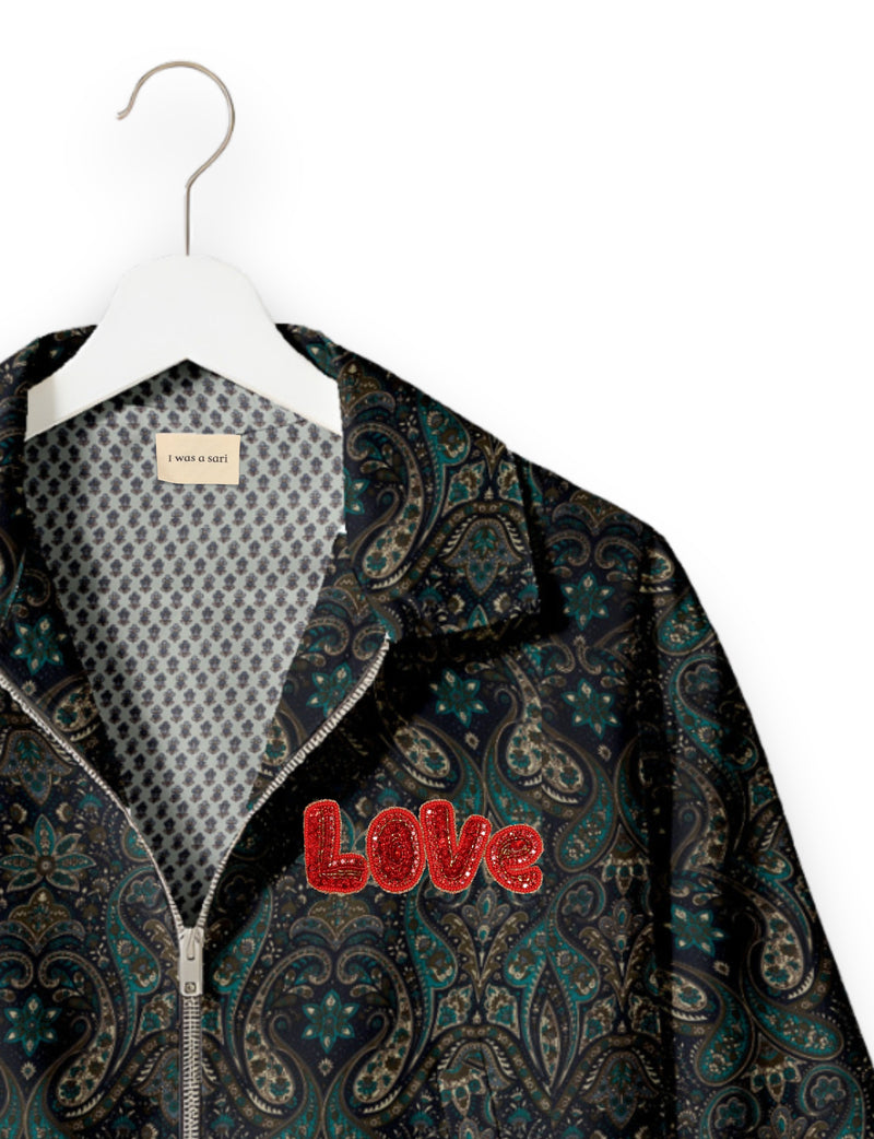 Love Bomber Jacket made from recycled fabric, featuring hand-stitched Aari embroidery. A unique piece of zero-waste clothing, part of the circular fashion movement. Designed with upcycled materials for a stylish yet environmentally friendly clothing choice.